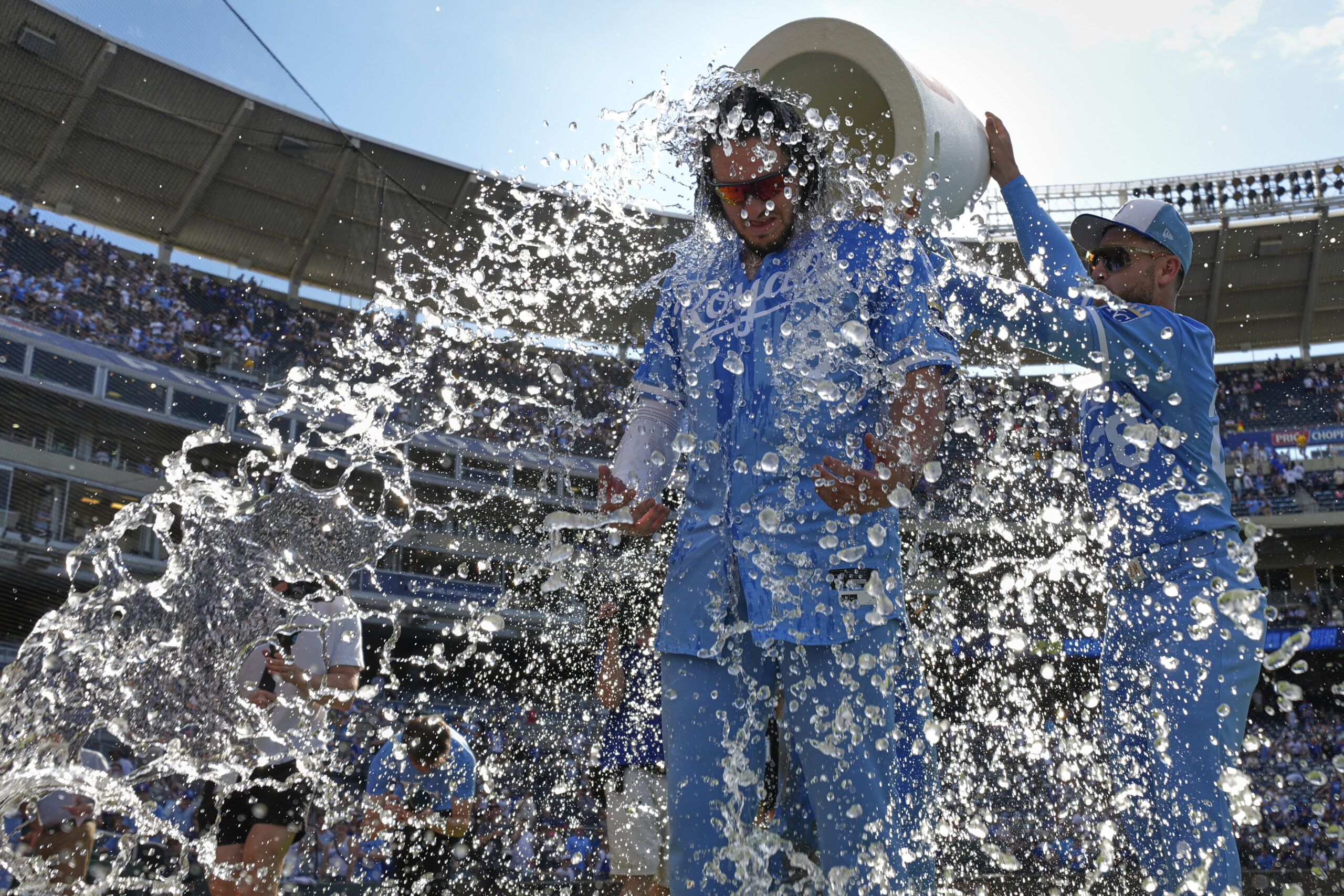 Kansas City Royals’ Vinnie Pasquantino is doused by Kyle Isbel...