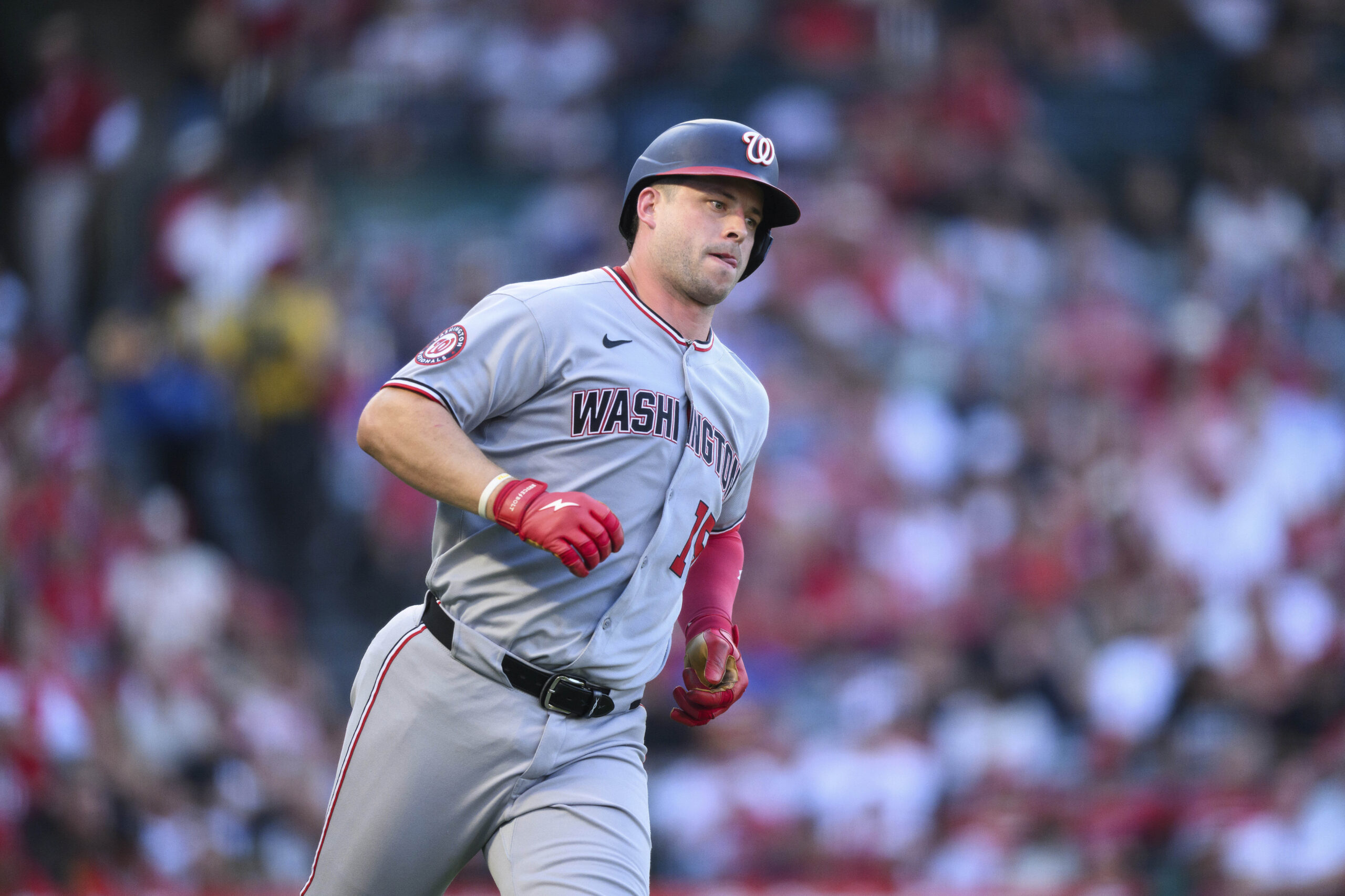 Washington Nationals’ Riley Adams runs after hitting a single during...