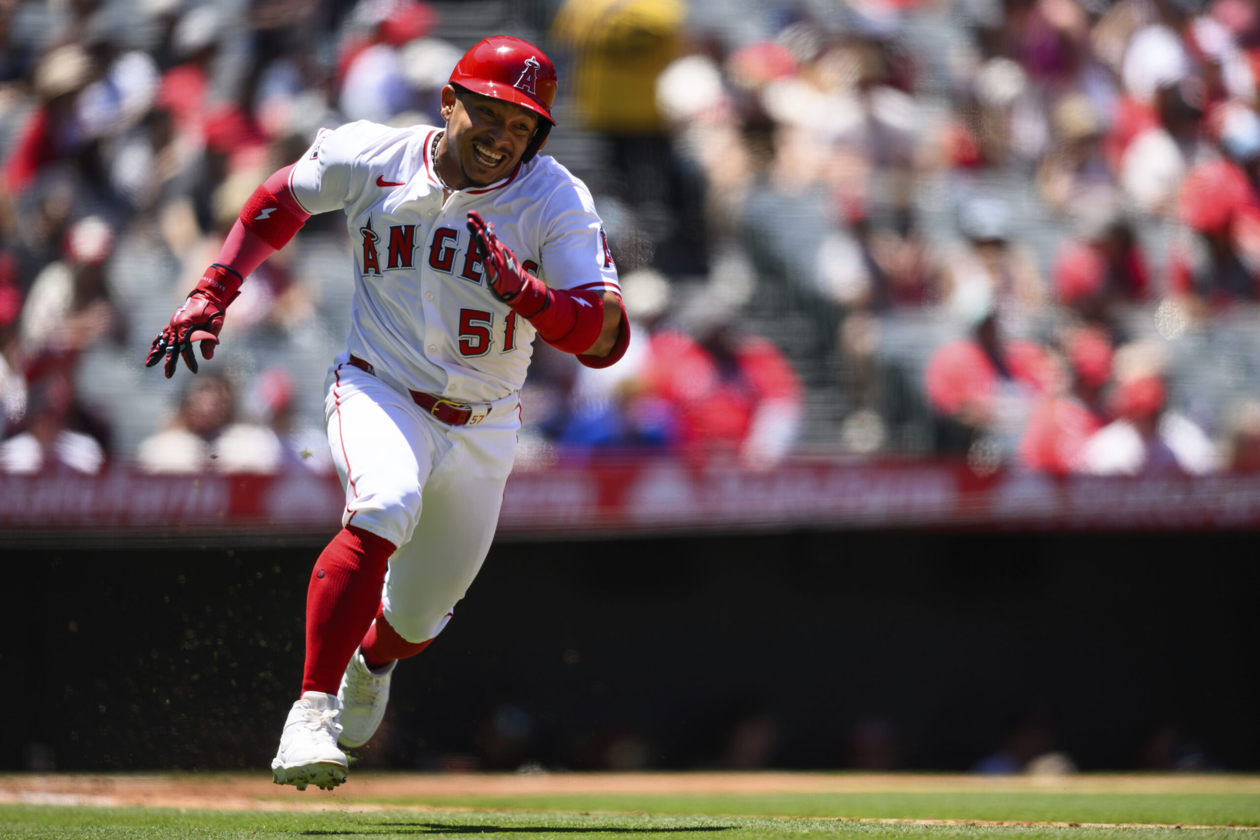 Angels’ Gustavo Campero runs after hitting a flyout during the...