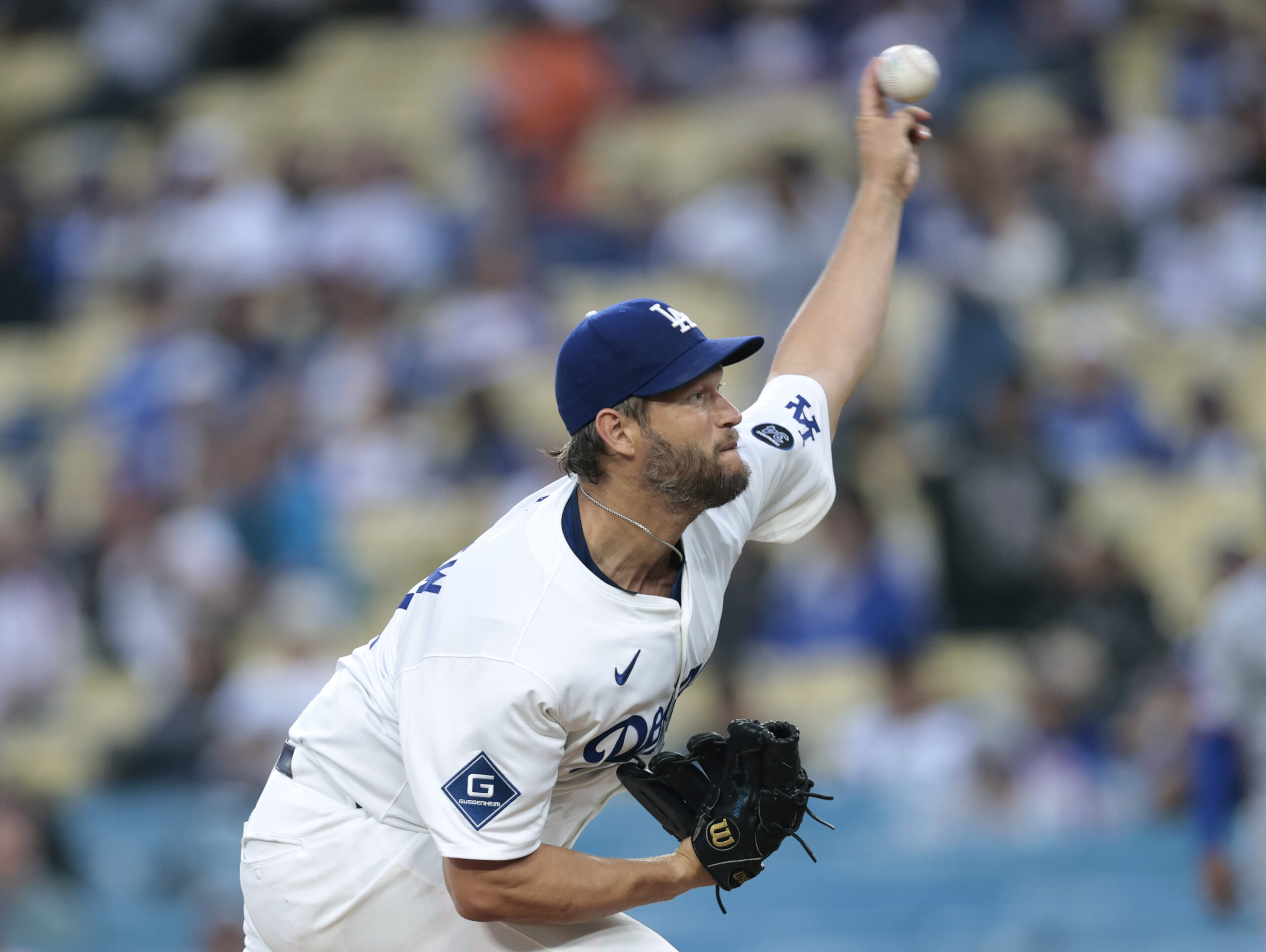 Dodgers starting pitcher Clayton Kershaw throws to the plate during...
