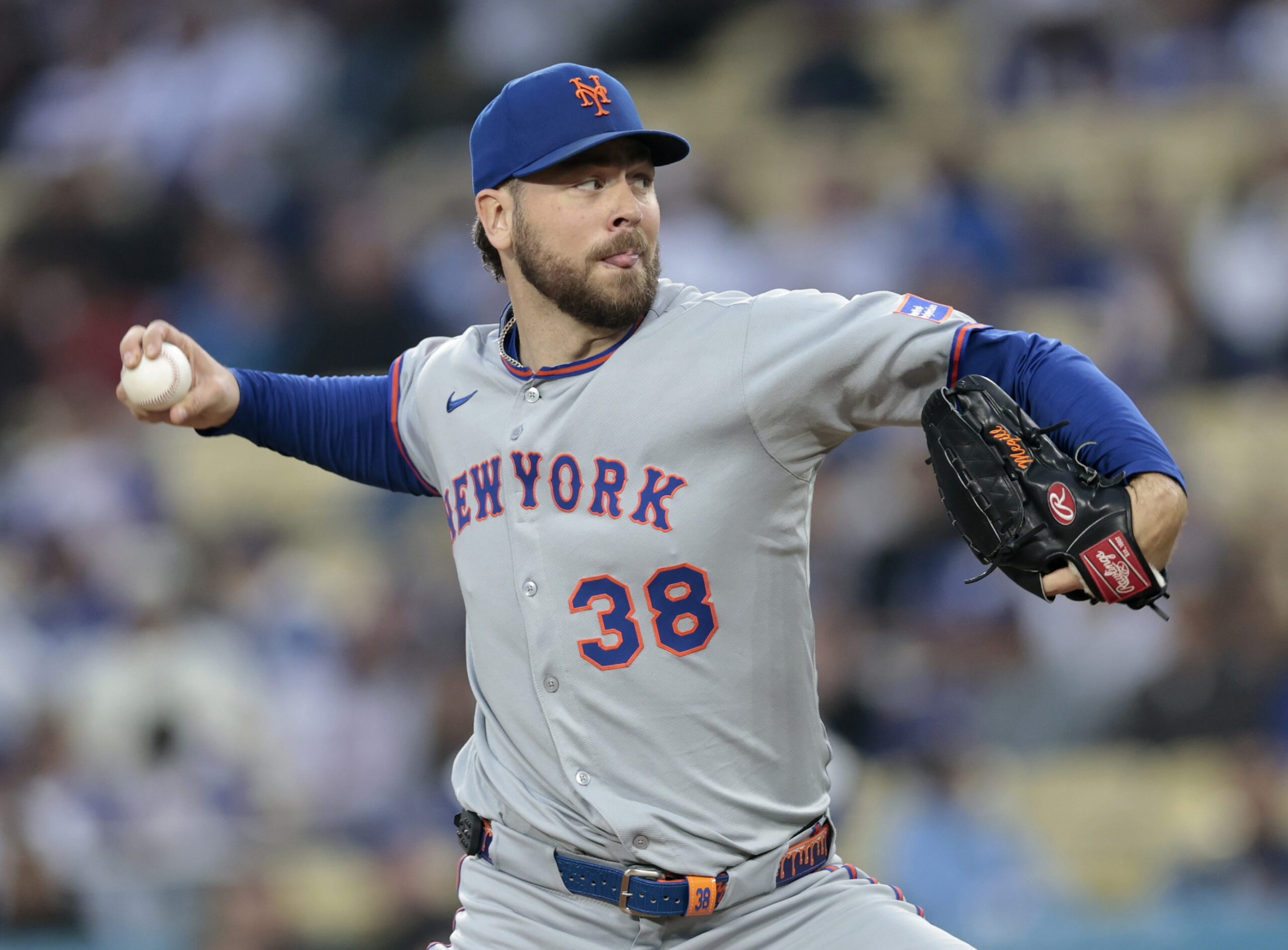 New York Mets starting pitcher Tylor Megill throws to the...