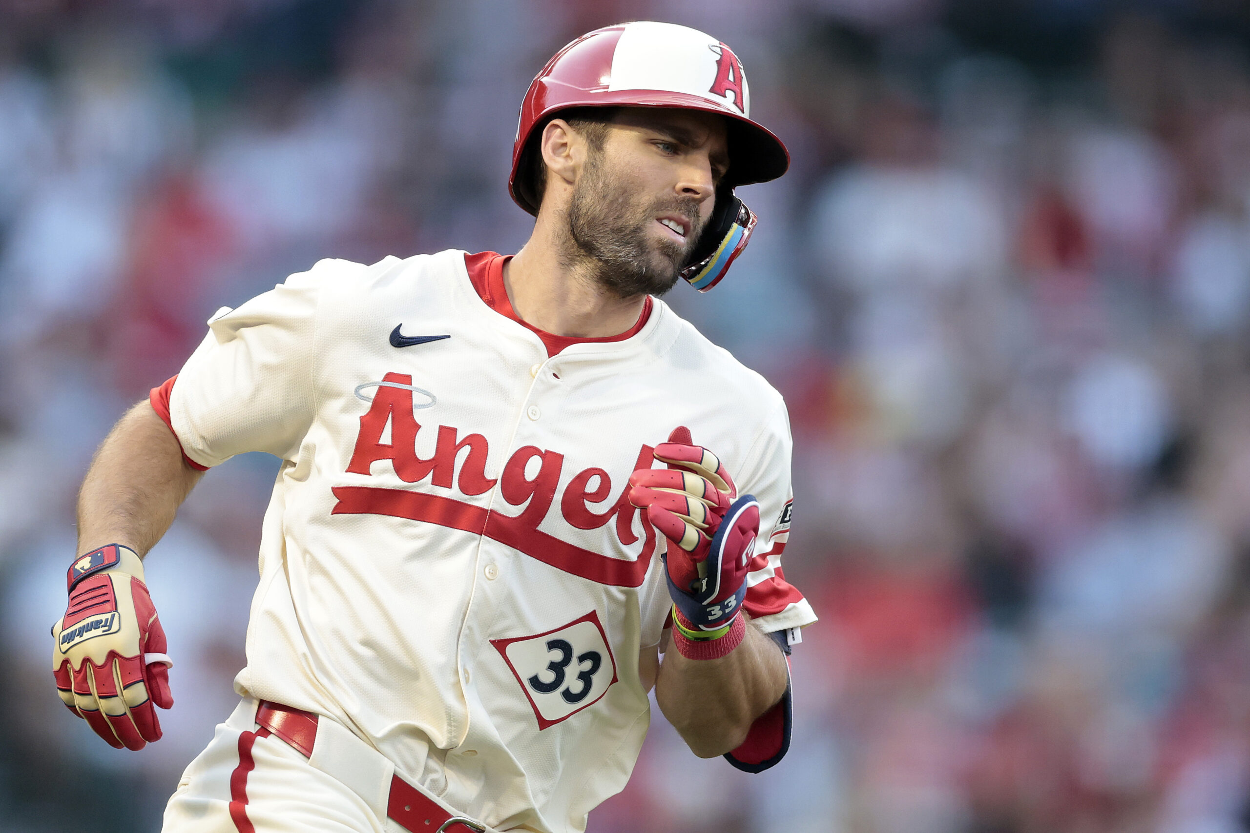 The Angels’ Chris Taylor runs after hitting a single during...