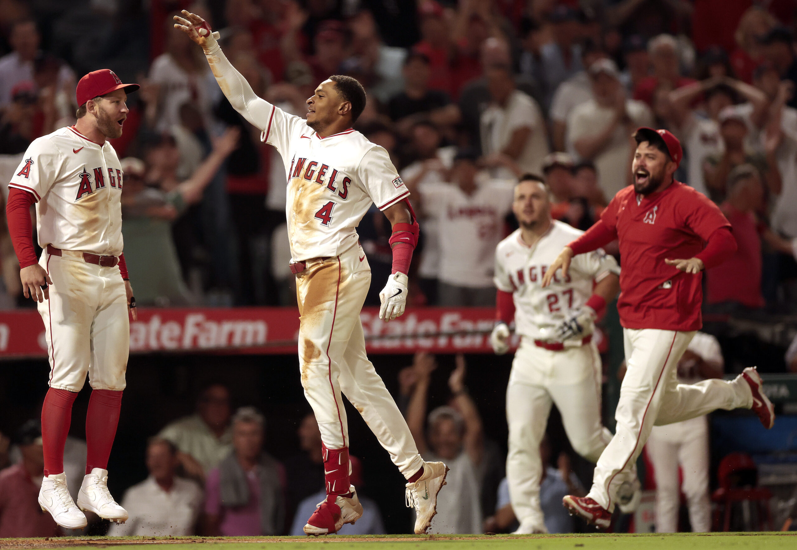The Angels’ Christian Moore, center, celebrates after hitting a two-run,...
