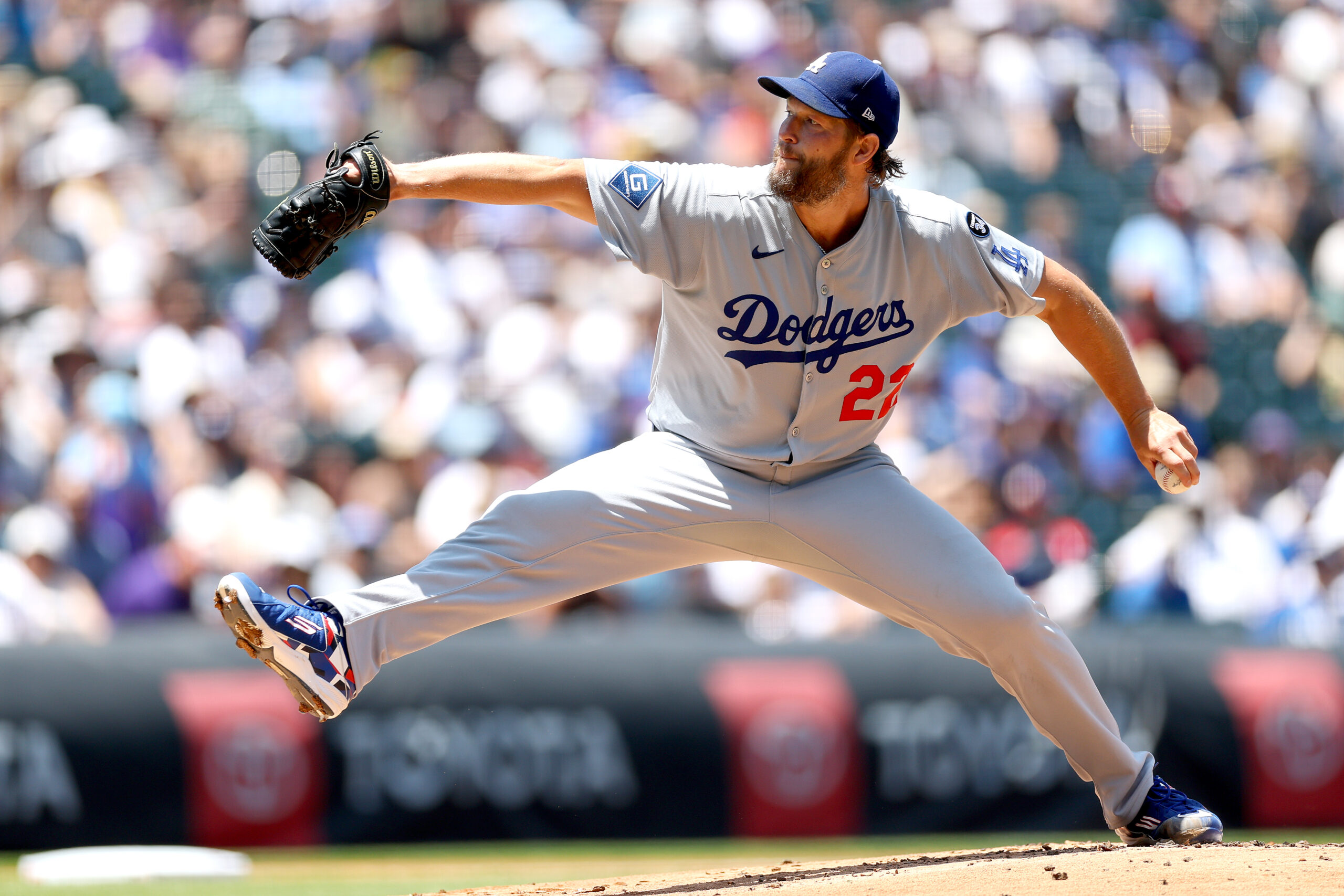 Dodgers starting pitcher Clayton Kershaw throws to the plate during...