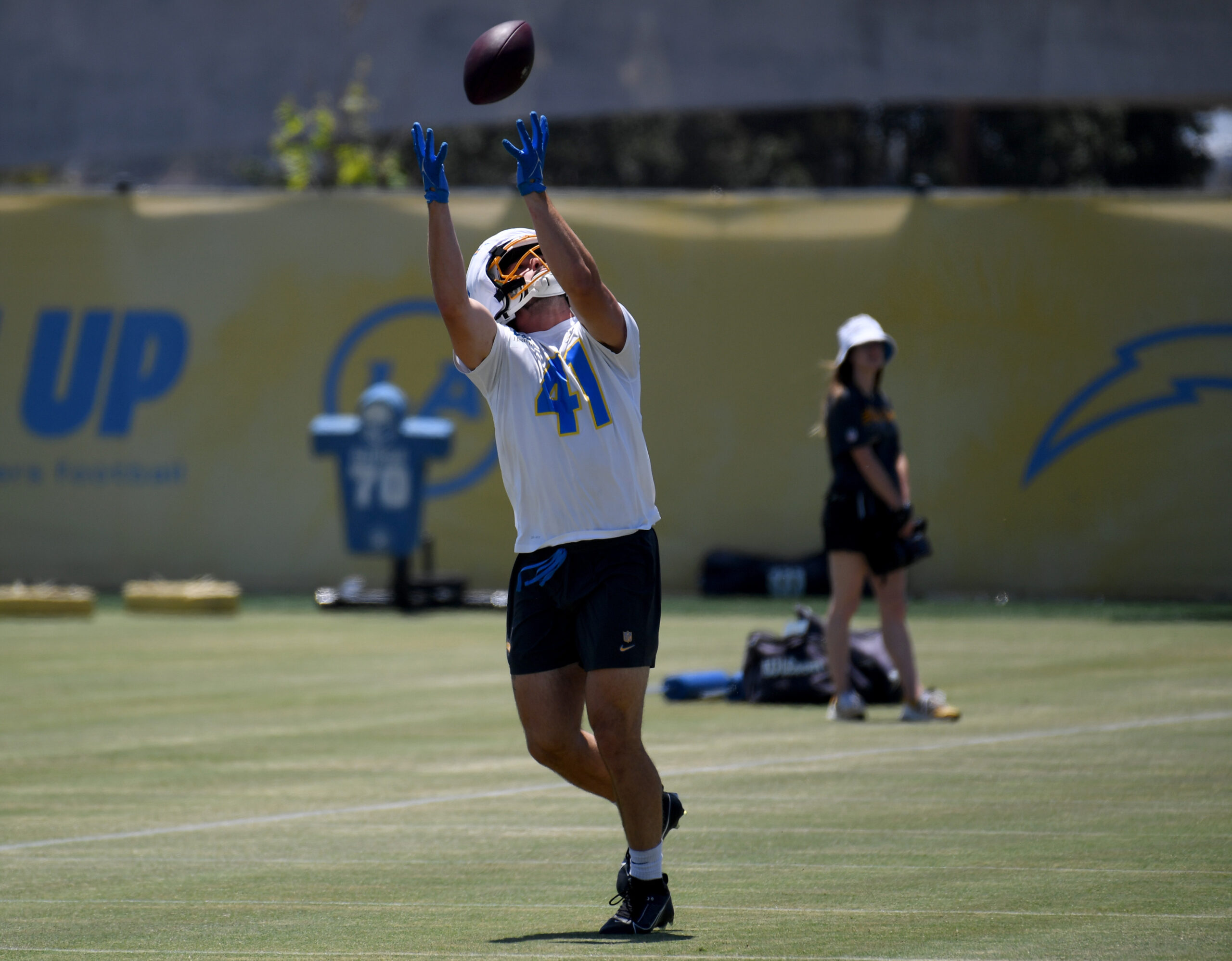 Chargers rookie tight end Stevo Klotz reaches for the ball...