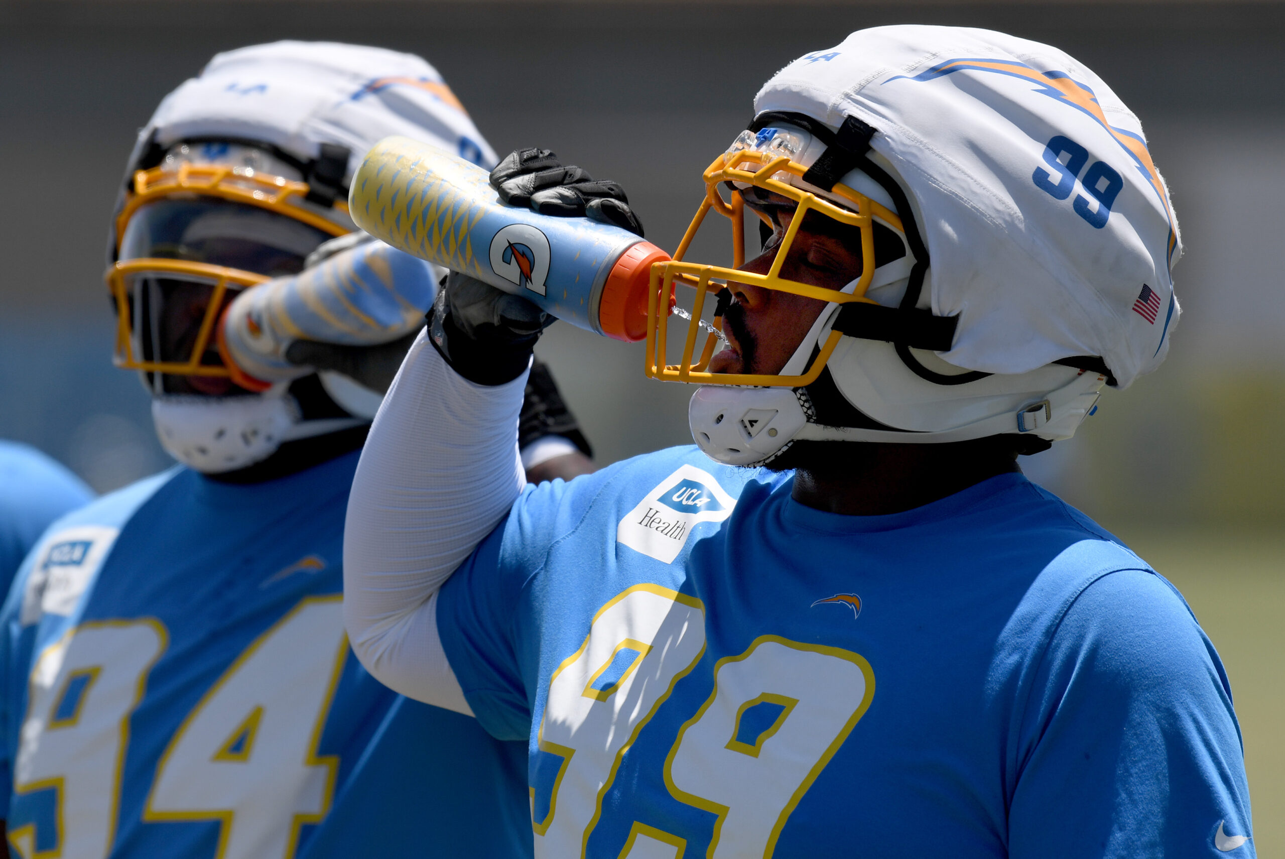 Chargers rookie defensive lineman Jamaree Caldwell stays hydrated as he...