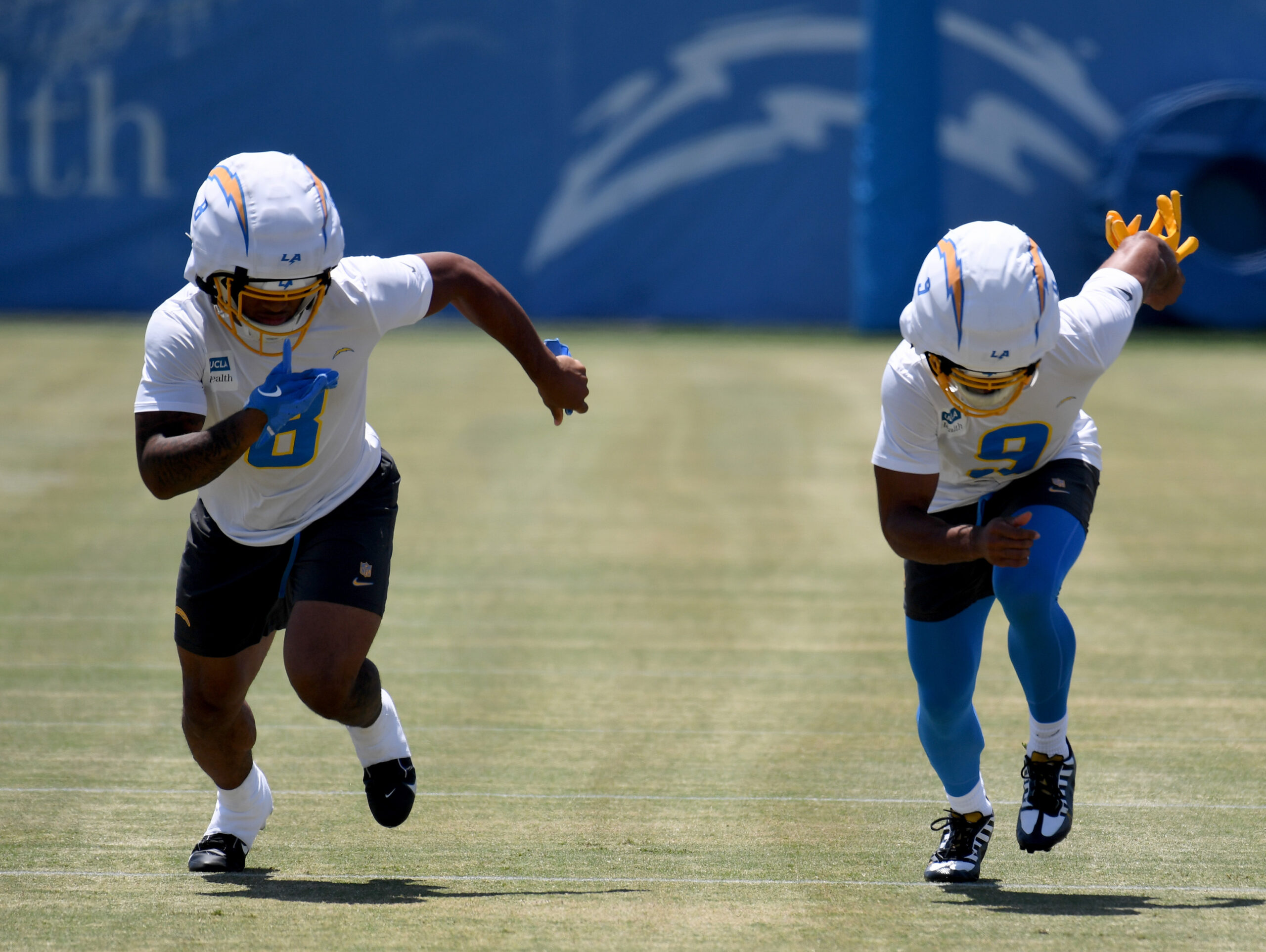 Chargers rookie running back Omarion Hampton, left, and rookie wide...