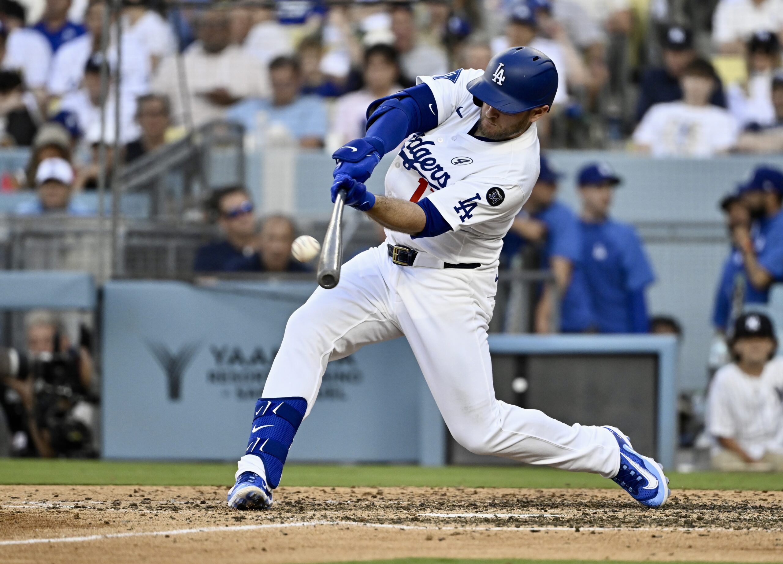 Max Muncy #13 of the Dodgers hits a solo home...