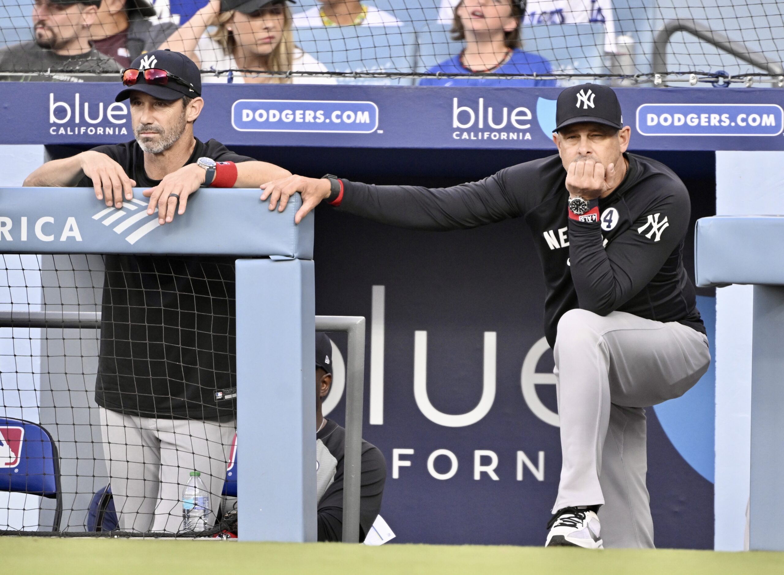 Manager Aaron Boone, right, along with bench coach Brad Ausmus...