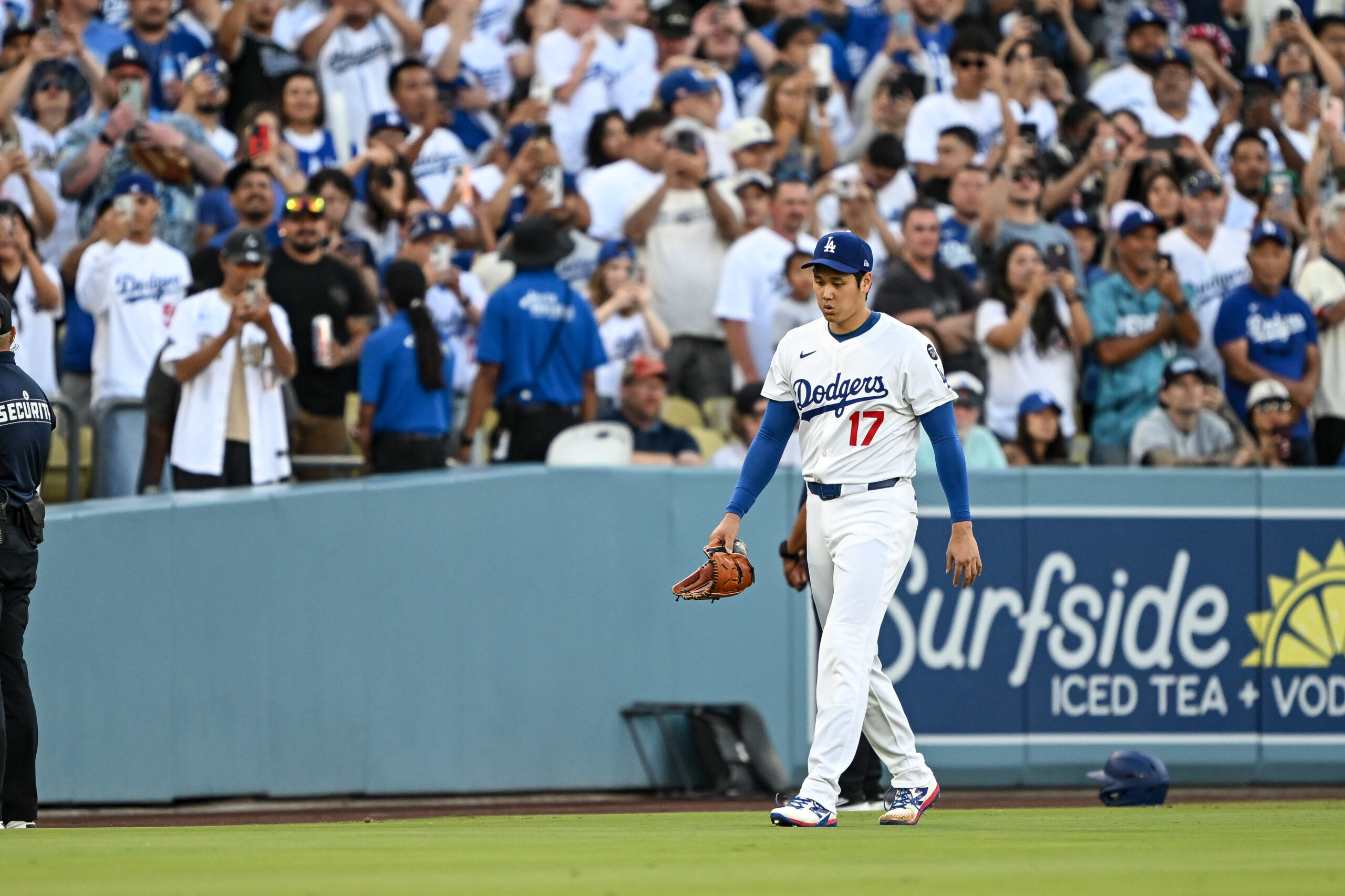 Dodgers starting pitcher Shohei Ohtani makes his way to the...