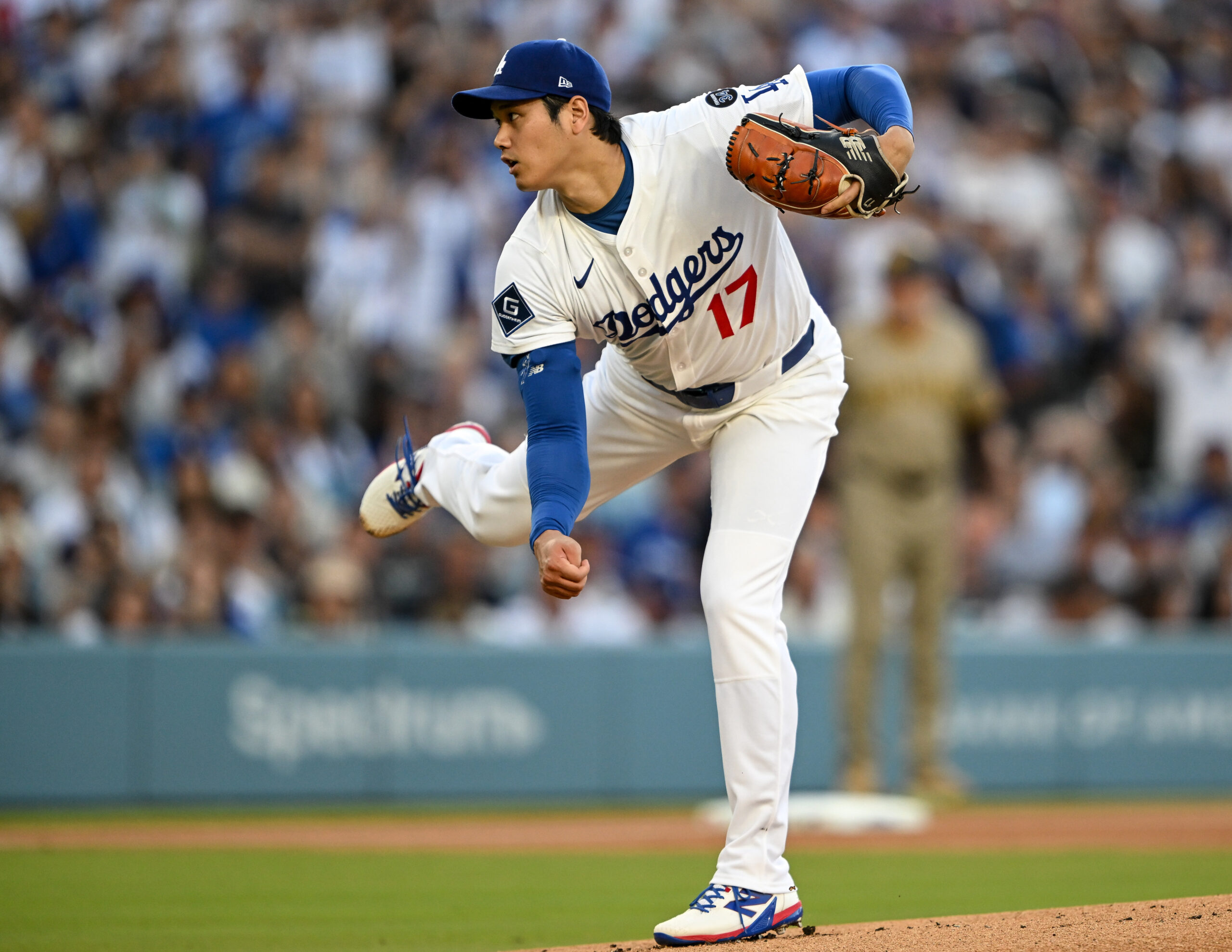 Dodgers starting pitcher Shohei Ohtani throws to the plate during...