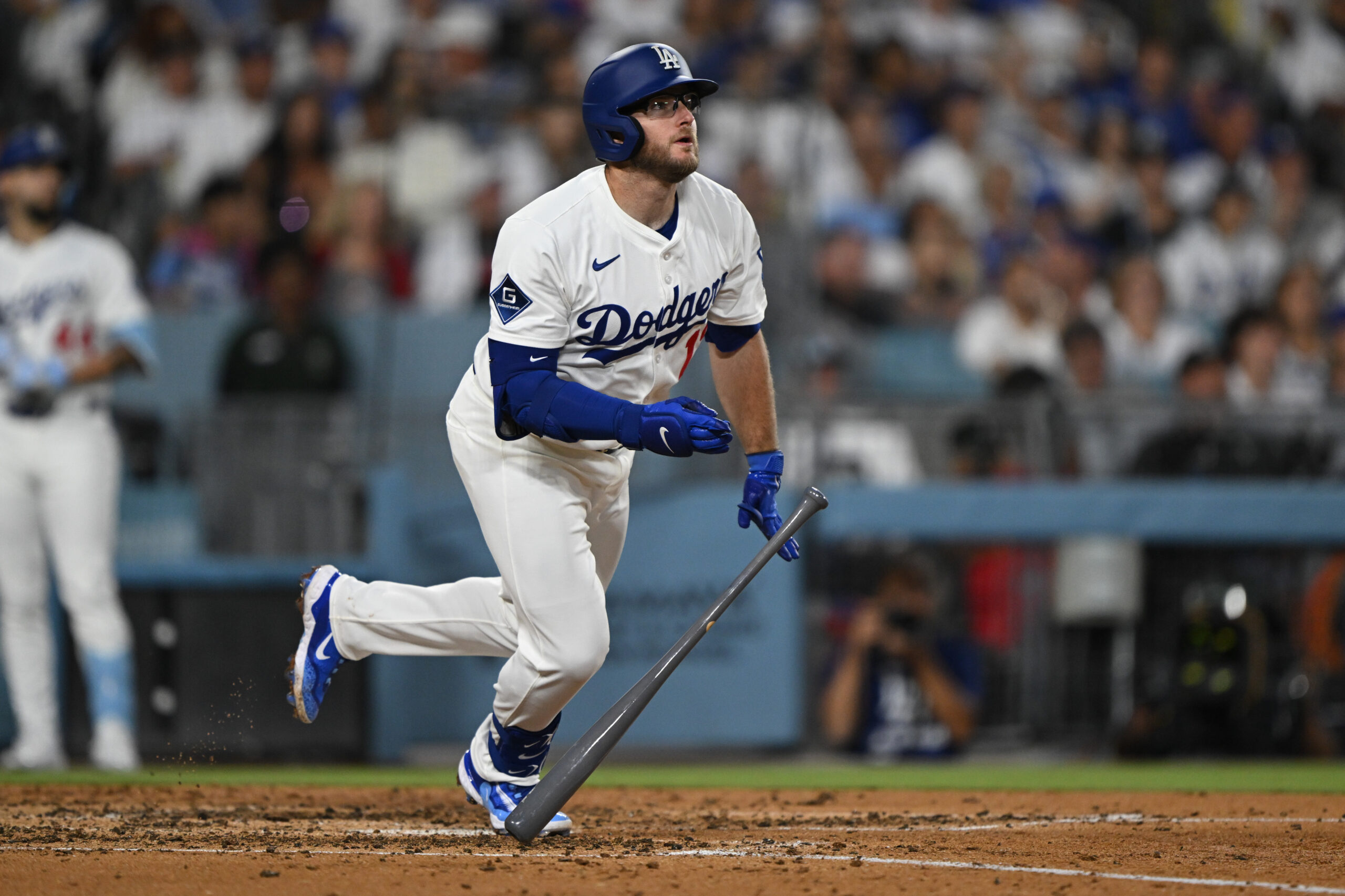 The Dodgers’ Max Muncy hits a triple during the fifth...