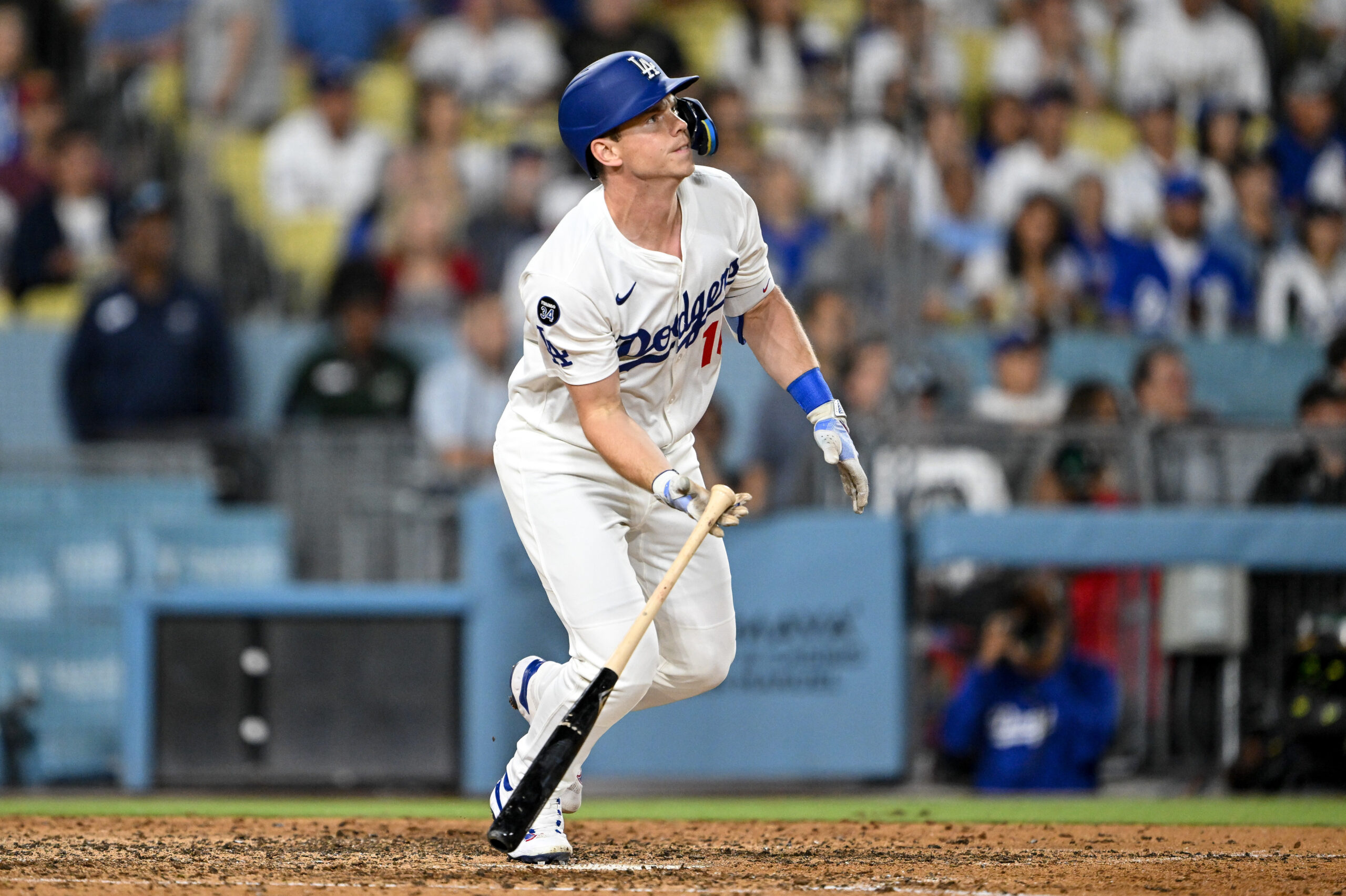 The Dodgers’ Will Smith drops his bat as he watches...