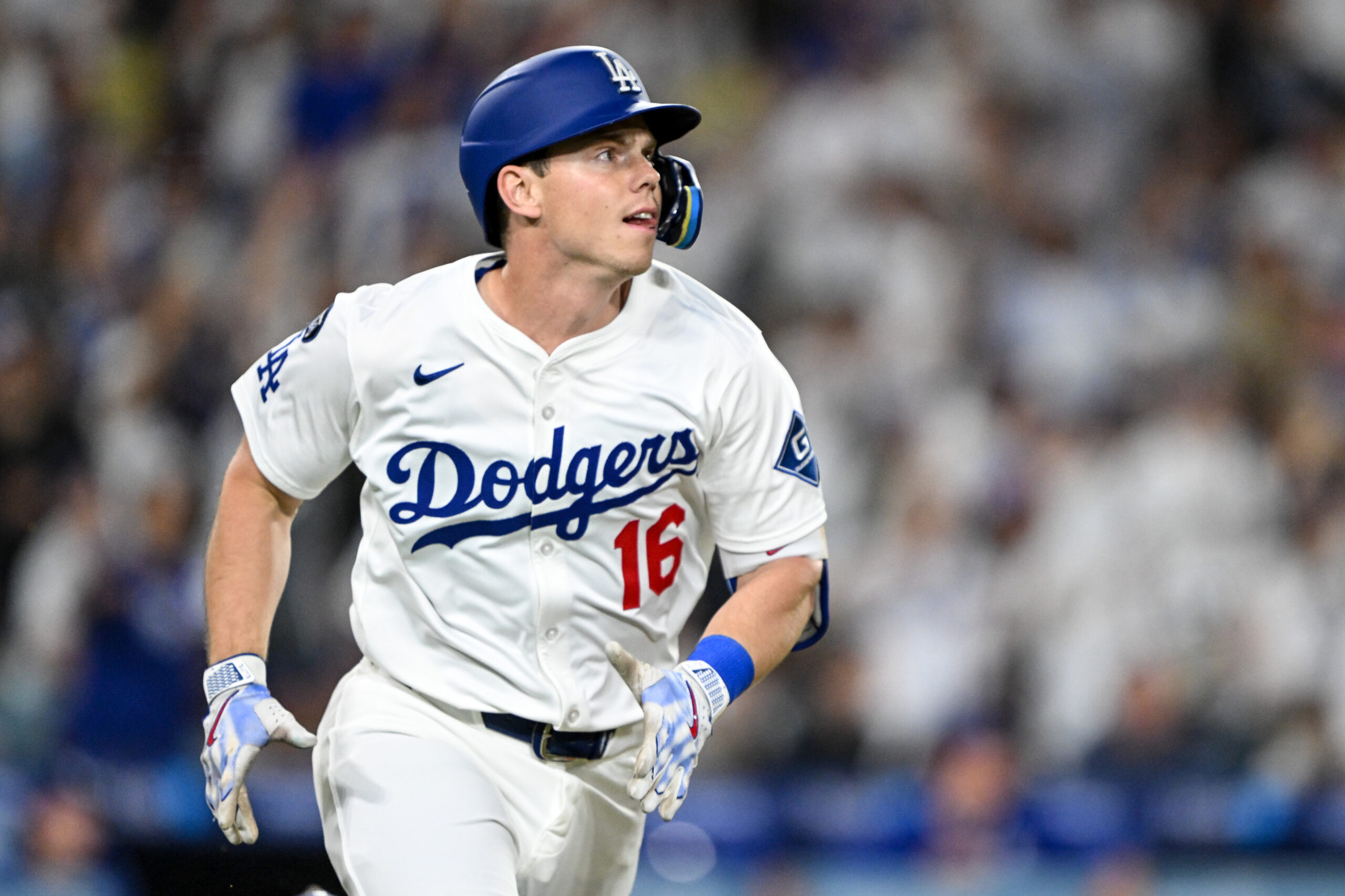 The Dodgers’ Will Smith begins to run the bases as...
