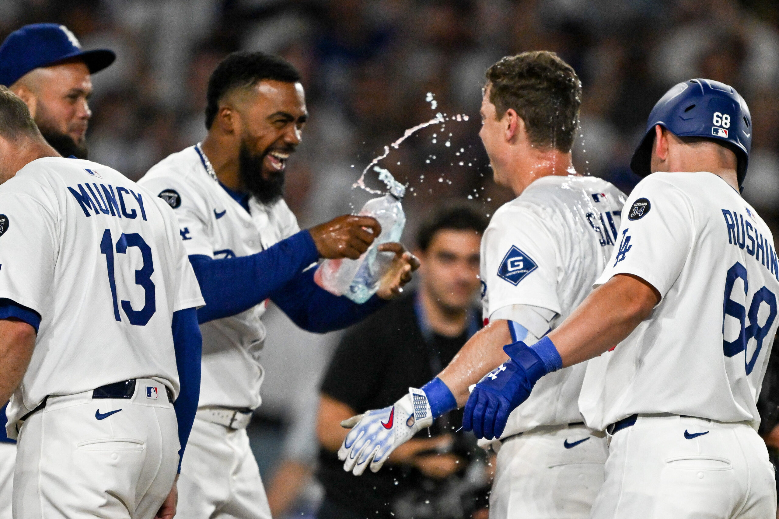 The Dodgers’ Will Smith, second from right, is sprayed with...