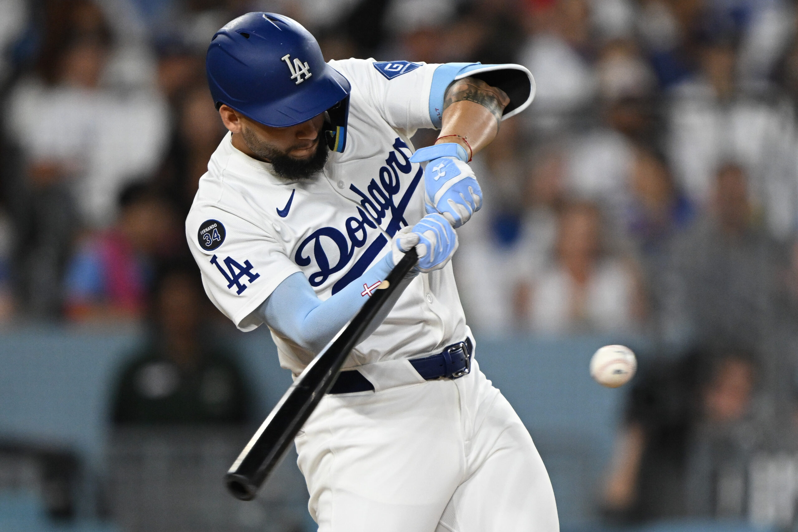 The Dodgers’ Andy Pages hits a sacrifice fly to score...