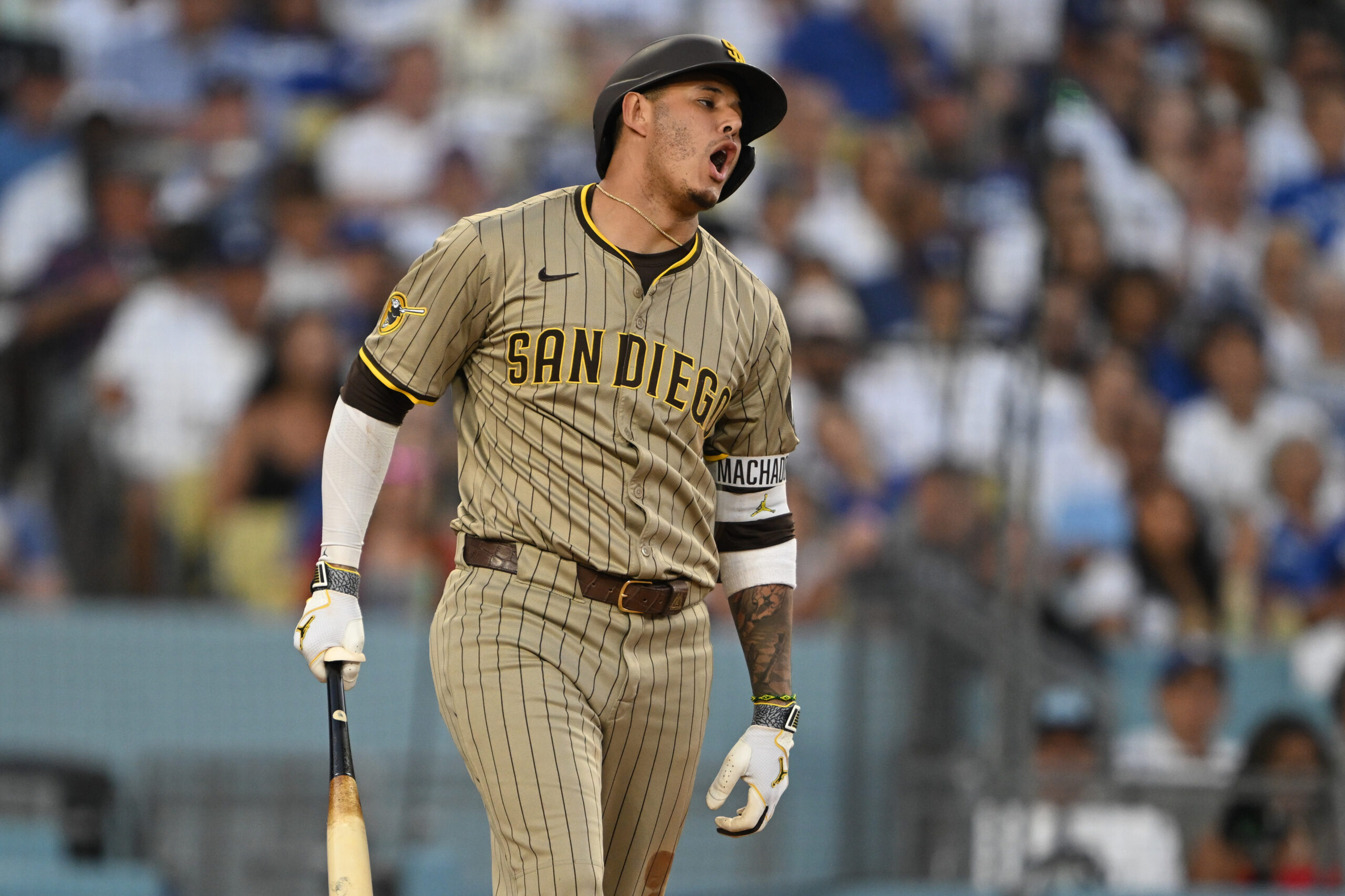 San Diego Padres star Manny Machado shows his frustration after...