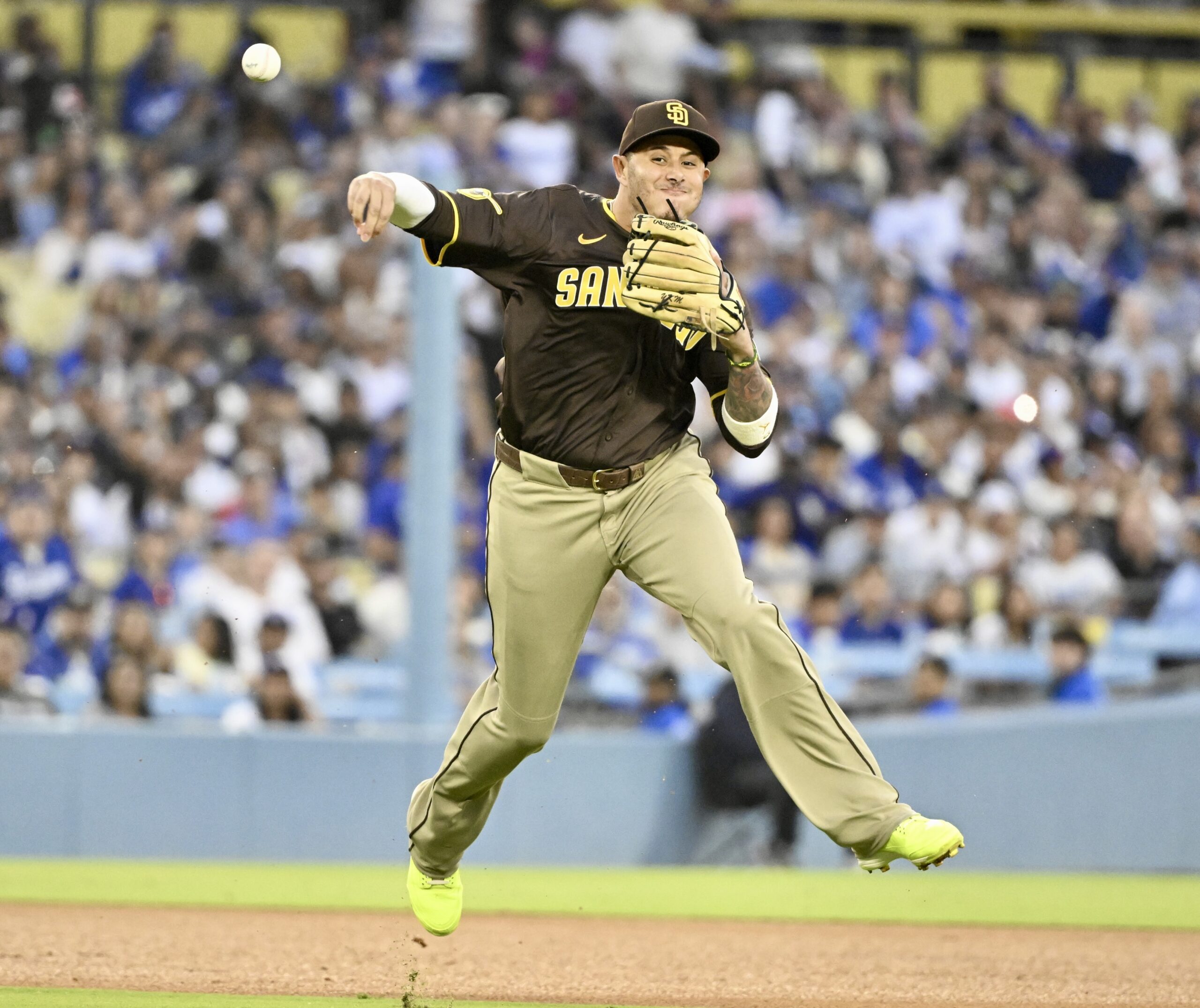 San Diego Padres third baseman Manny Machado throws out the...