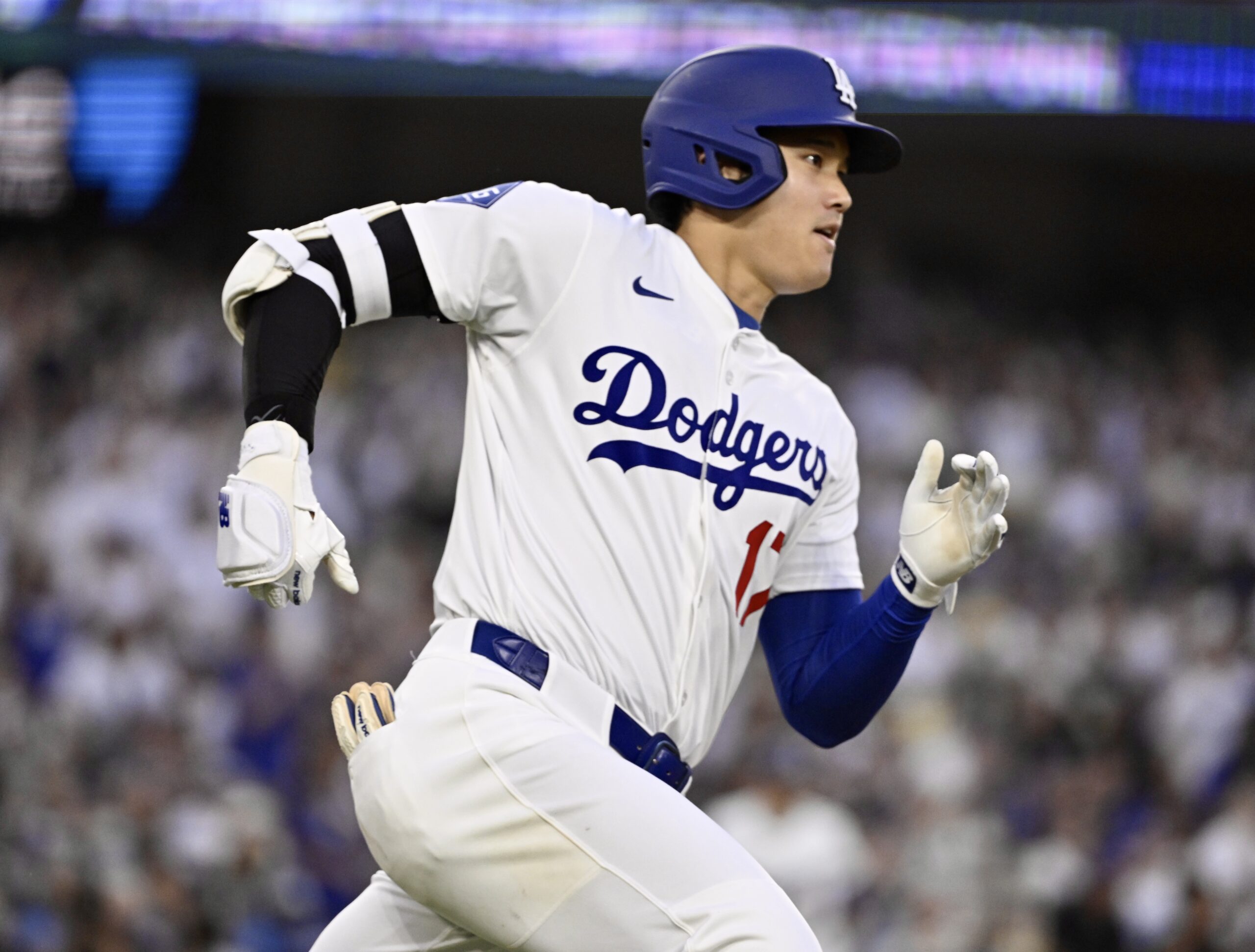 Dodgers star Shohei Ohtani singles against the San Diego Padres...