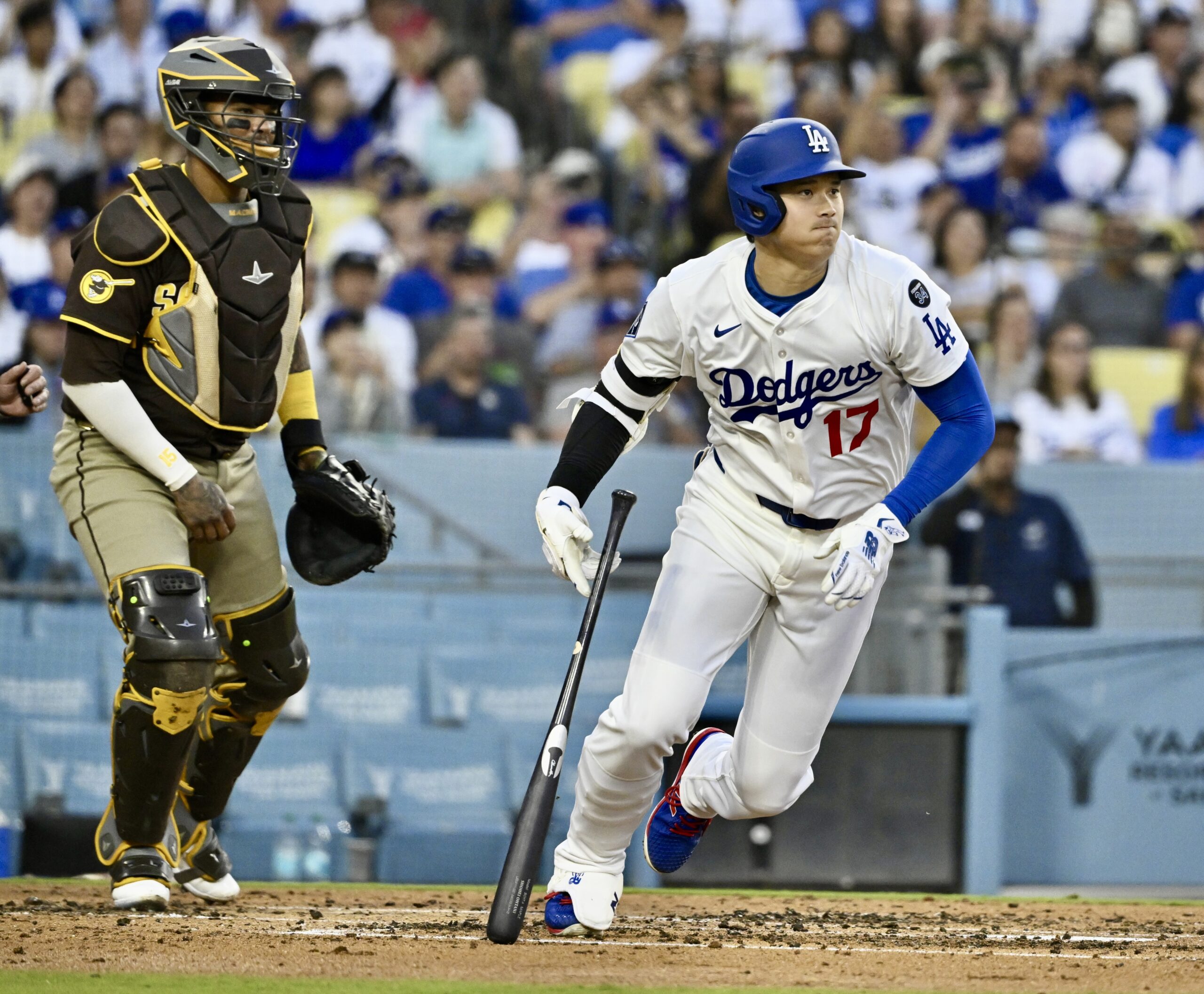 Dodgers star Shohei Ohtani singles against the San Diego Padres...