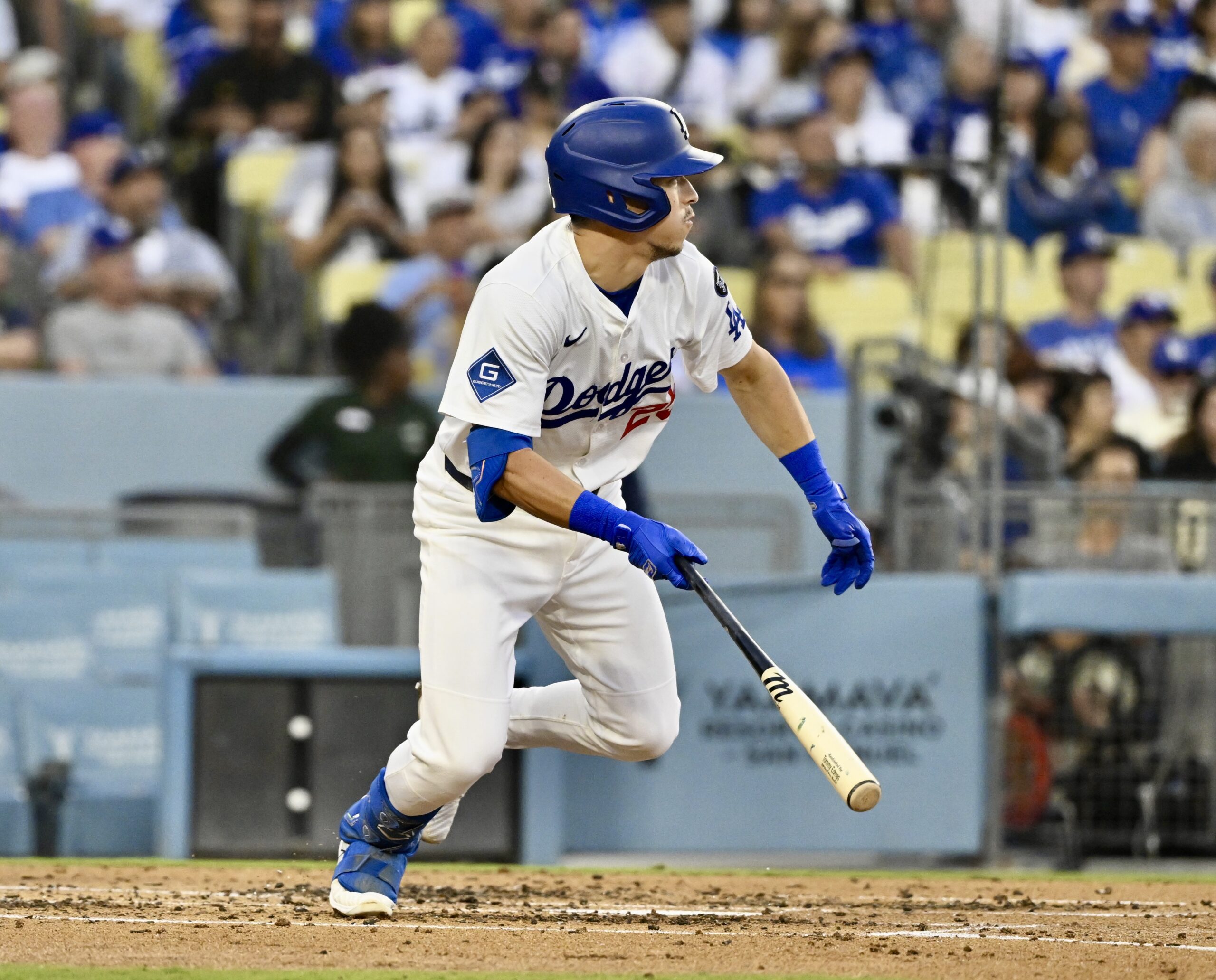The Dodgers’ Tommy Edman singles against the San Diego Padres...
