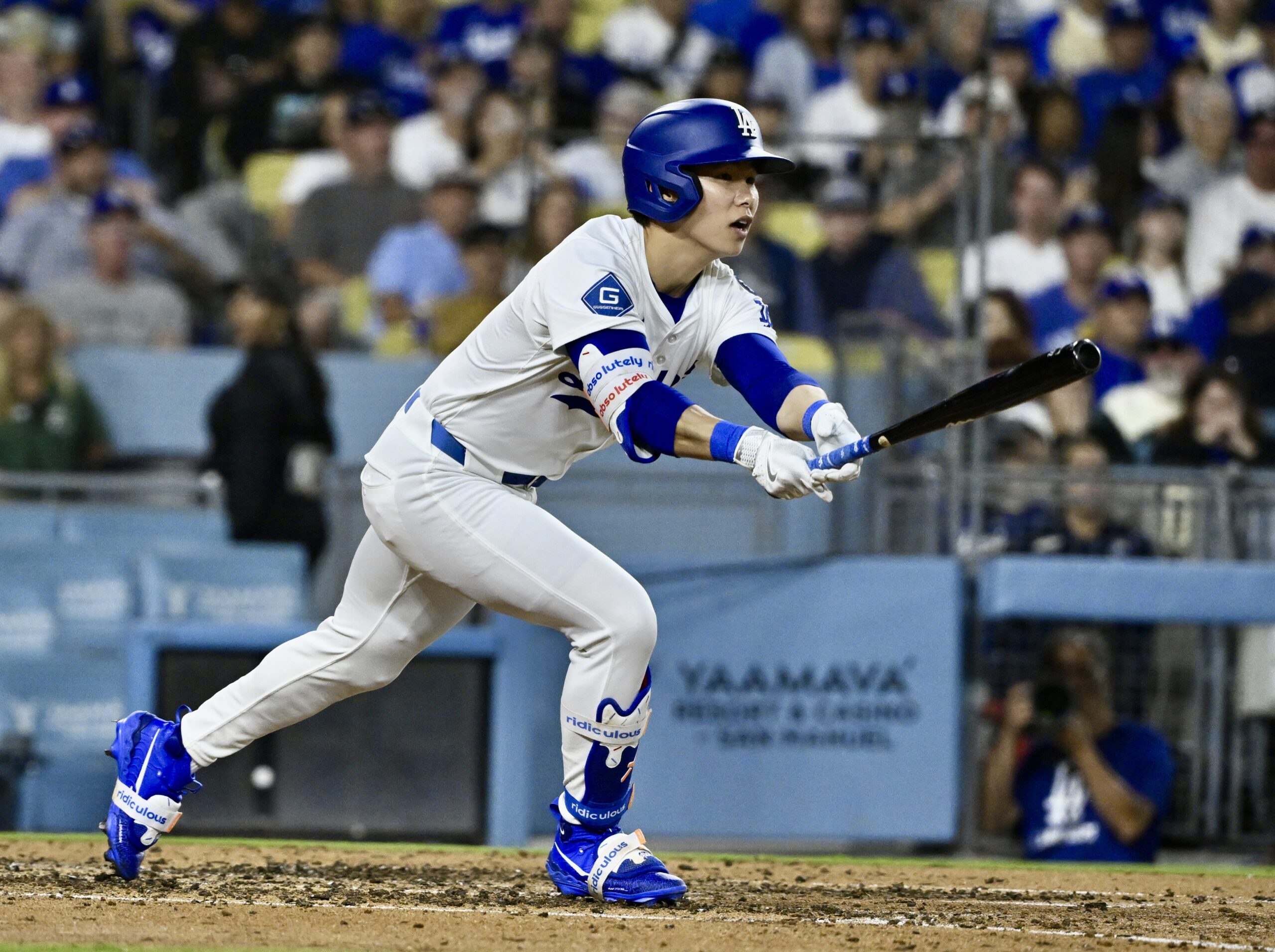 The Dodgers’ Hyeseong Kim singles as teammate Tommy Edman (not...