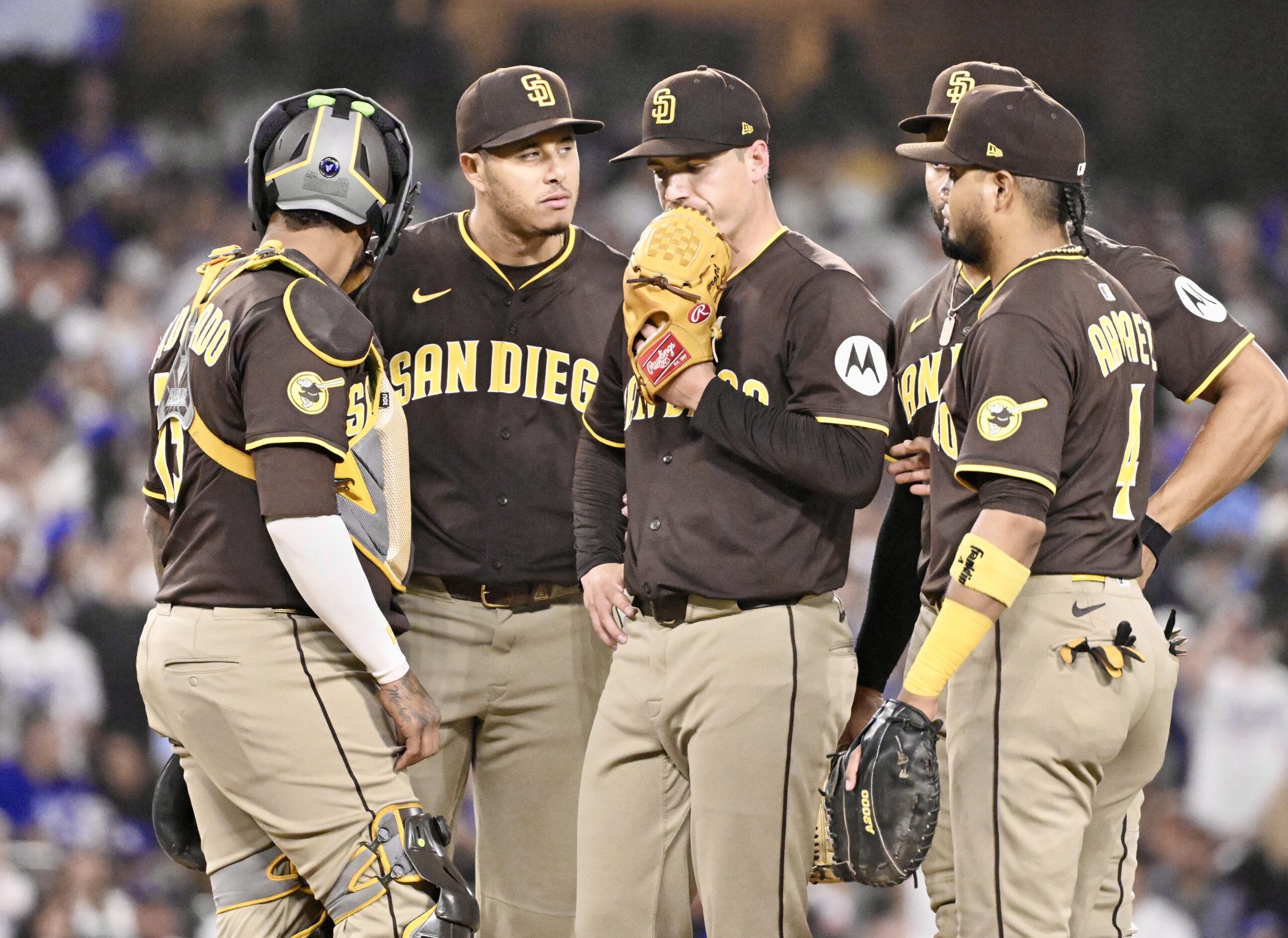 San Diego Padres starting pitcher Ryan Bergert, center, reacts as...