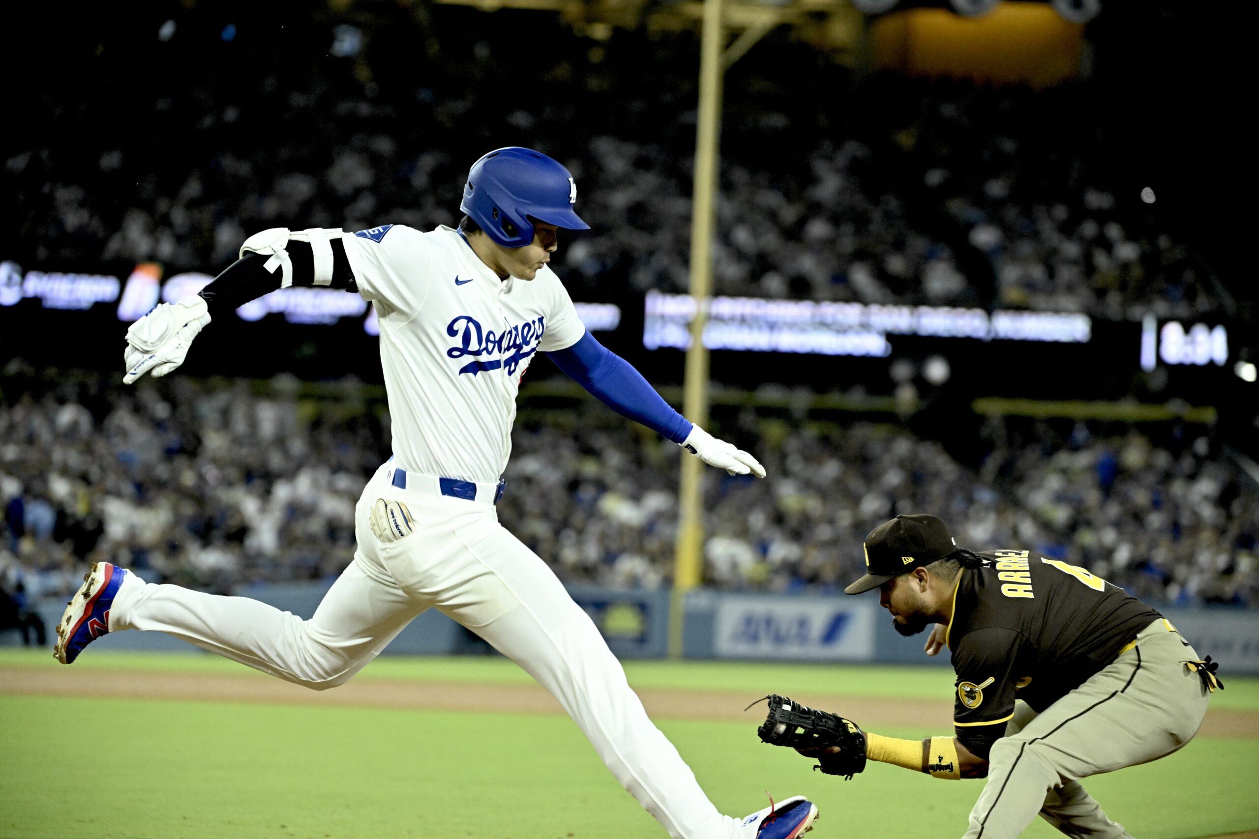Dodgers star Shohei Ohtani is out at first base as...