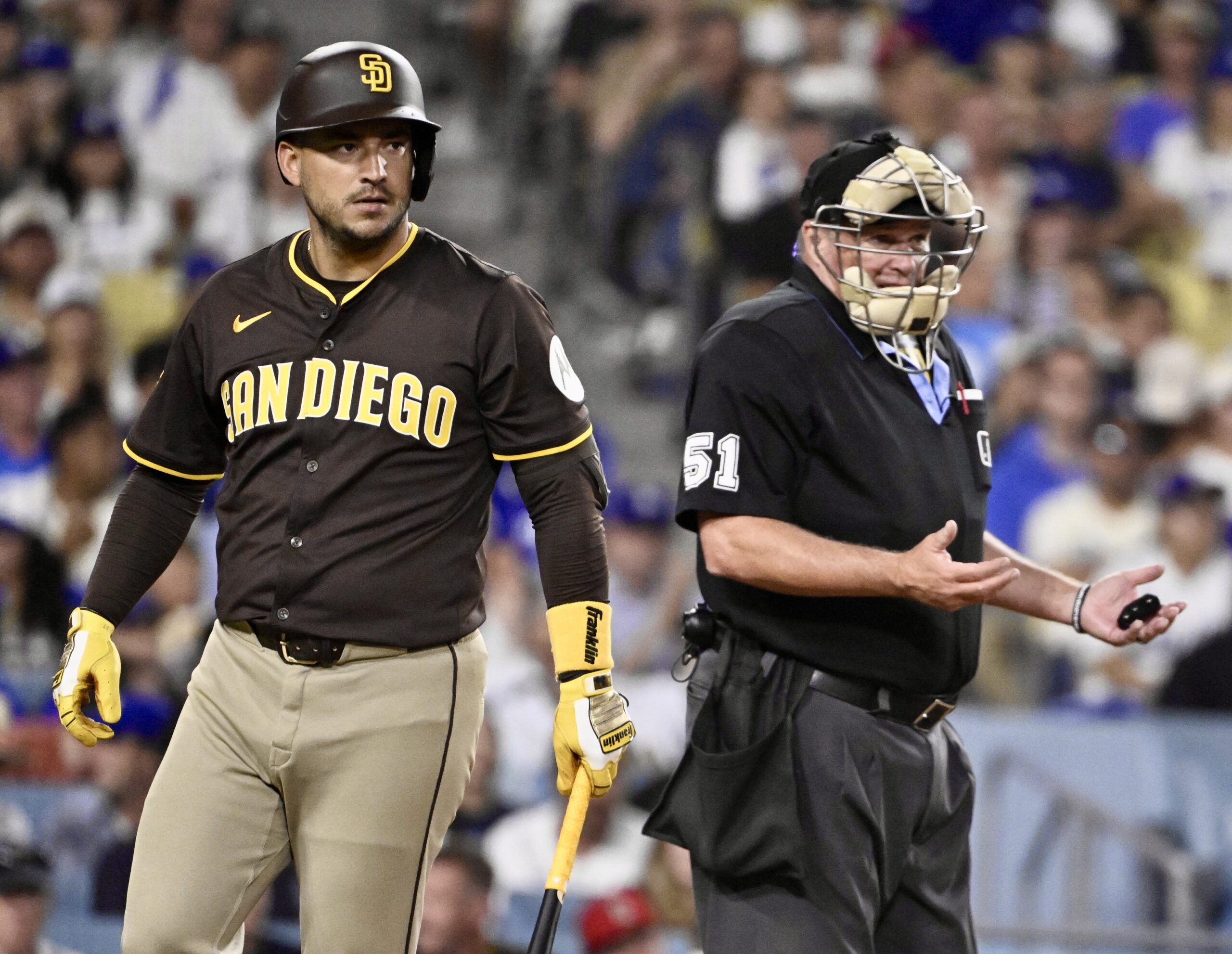 The San Diego Padres’ Jose Iglesias walks back to the...