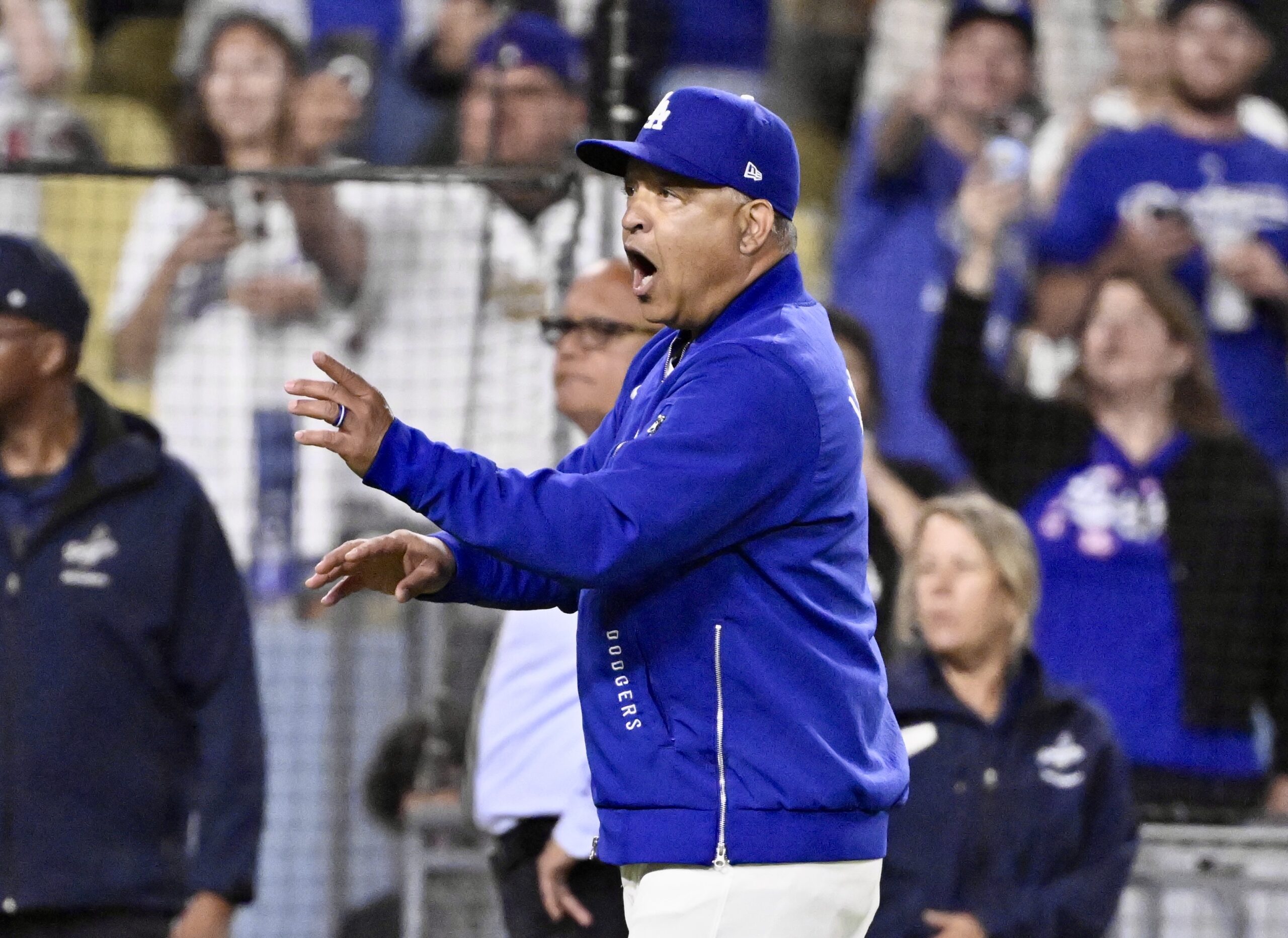 Dodgers manager Dave Roberts reacts after the benches cleared when...