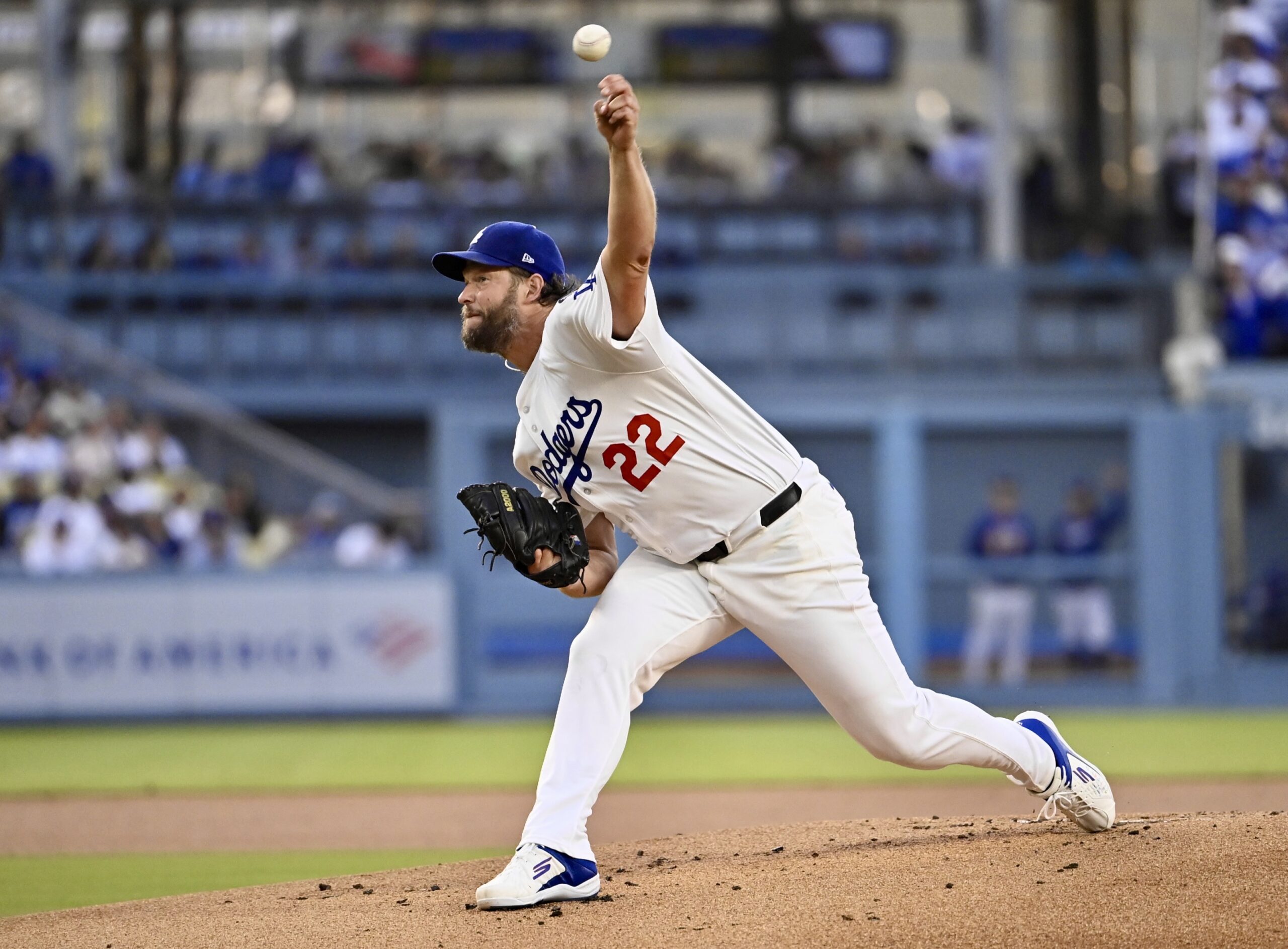 Dodgers starting pitcher Clayton Kershaw throws to the plate during...