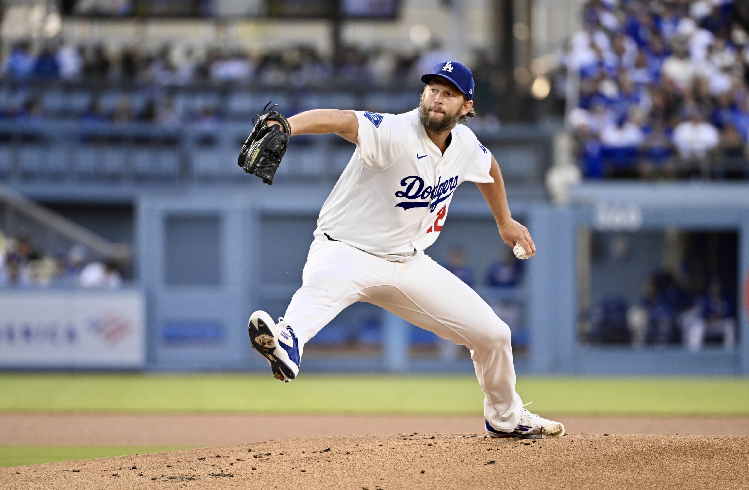Dodgers starting pitcher Clayton Kershaw throws to the plate during...