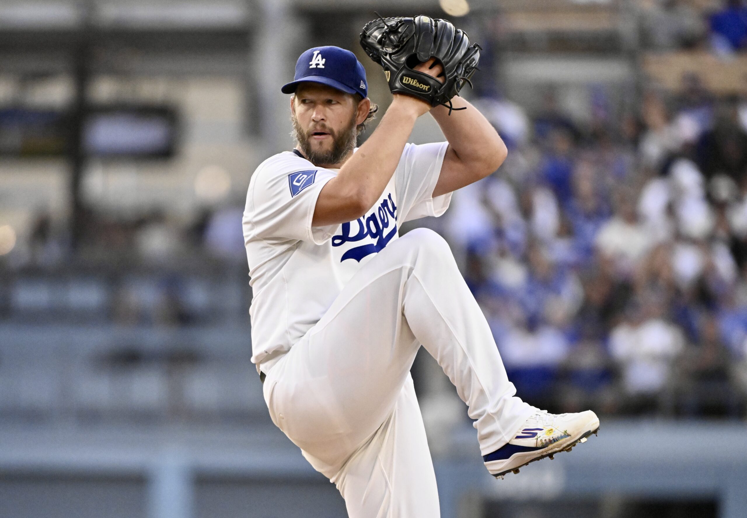 Dodgers starting pitcher Clayton Kershaw throws to the plate during...