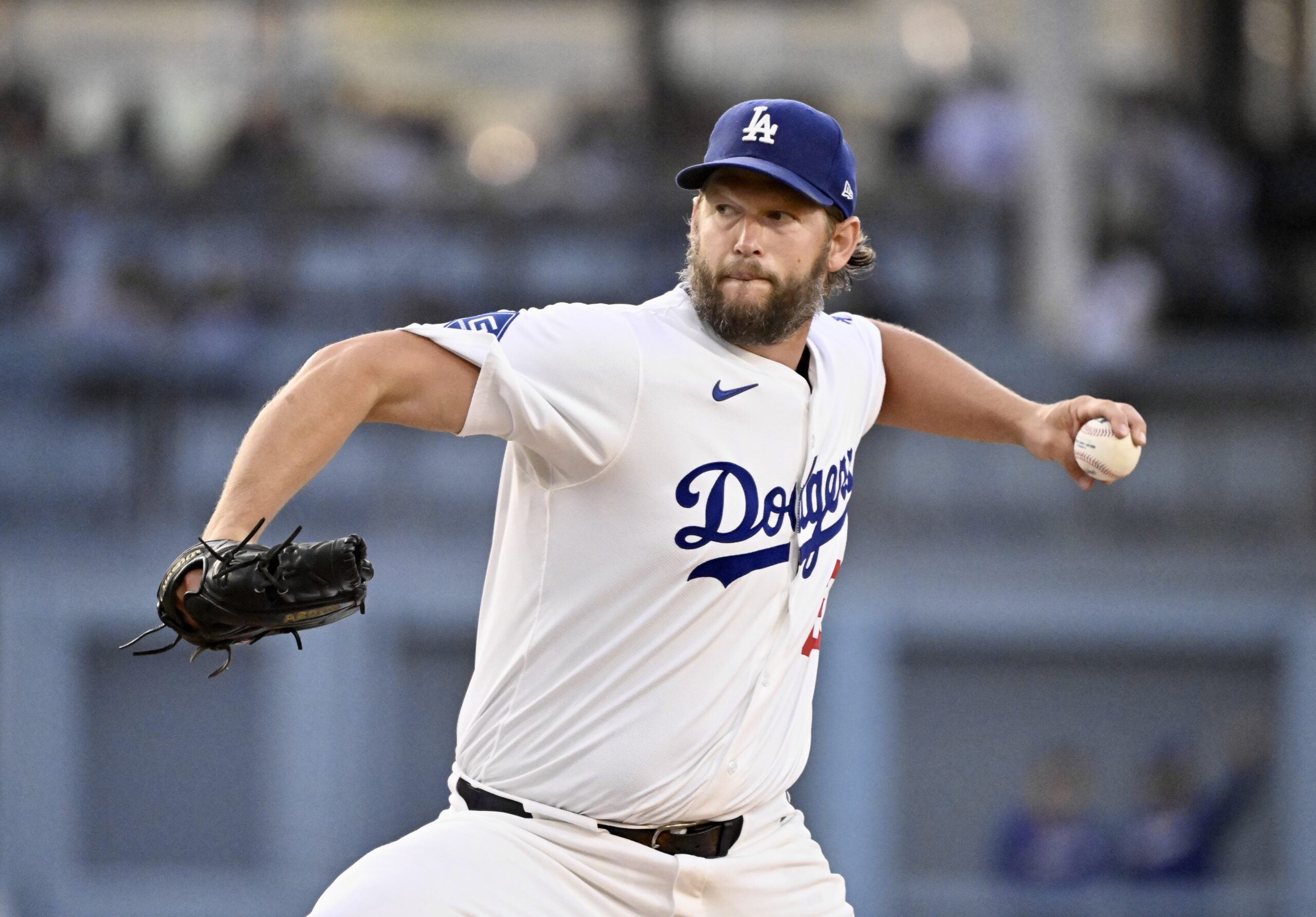 Dodgers starting pitcher Clayton Kershaw throws to the plate during...