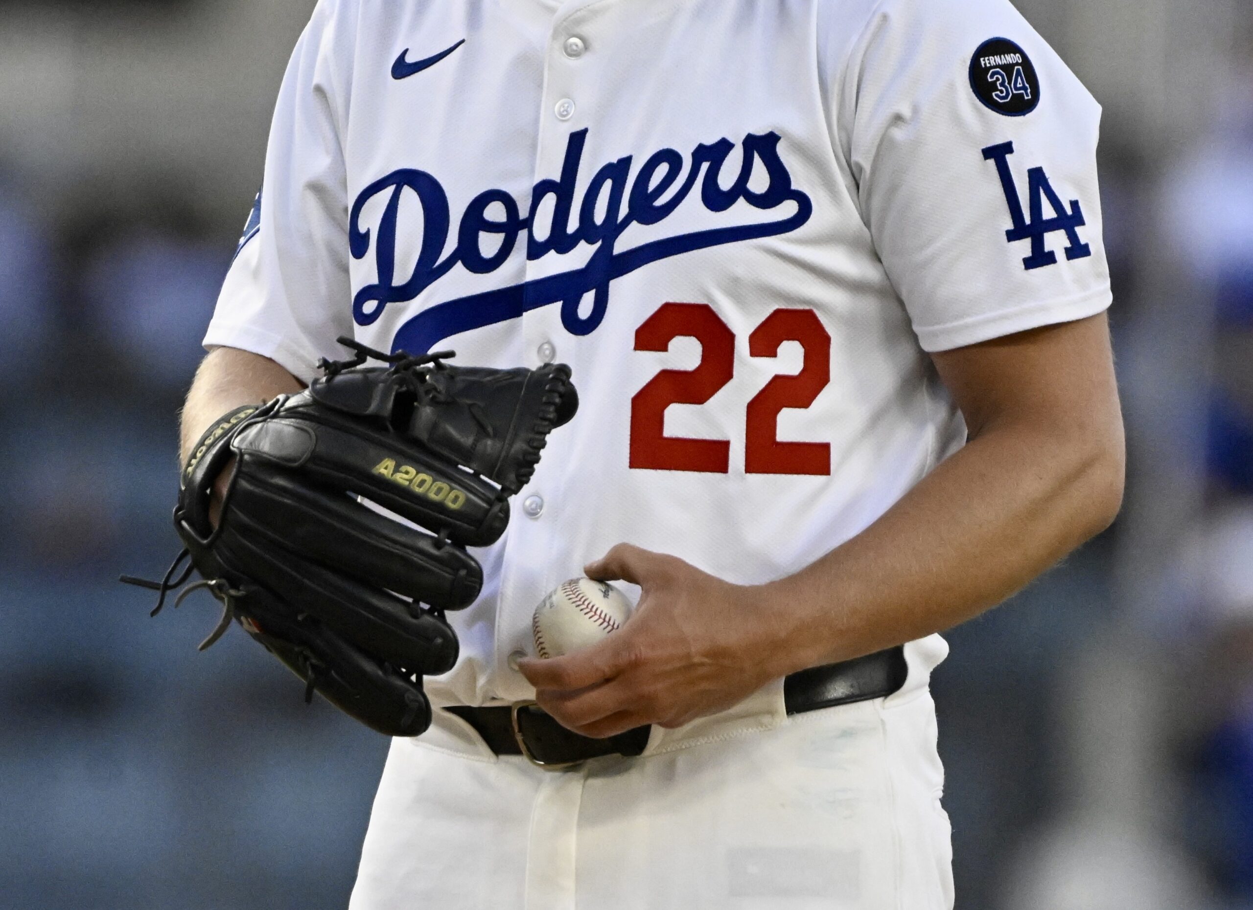 Dodgers starting pitcher Clayton Kershaw pauses between pitches during the...