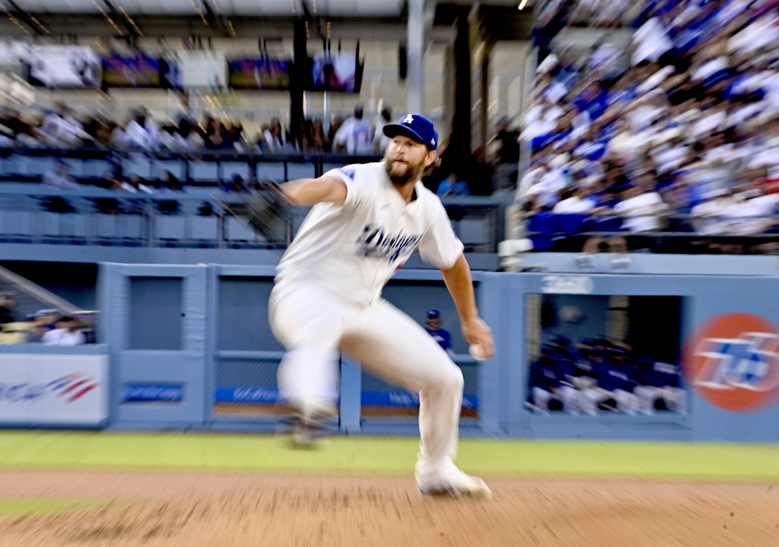 Dodgers starting pitcher Clayton Kershaw throws to the plate during...