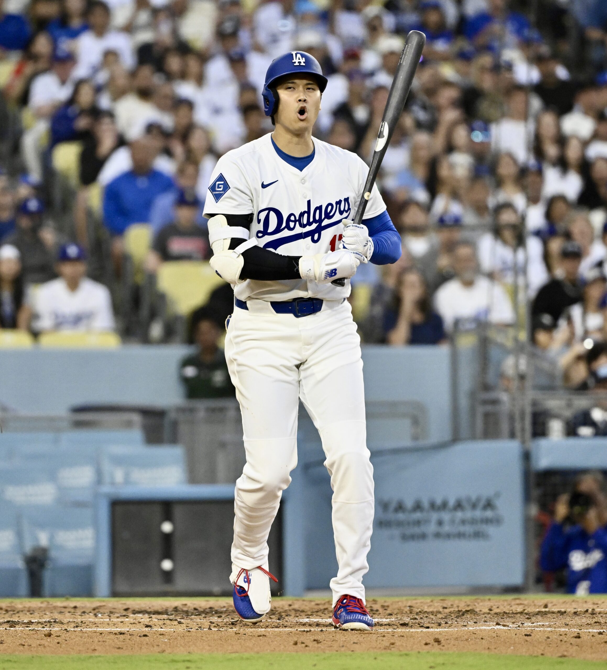 Dodgers star Shohei Ohtani reacts after a strike call during...