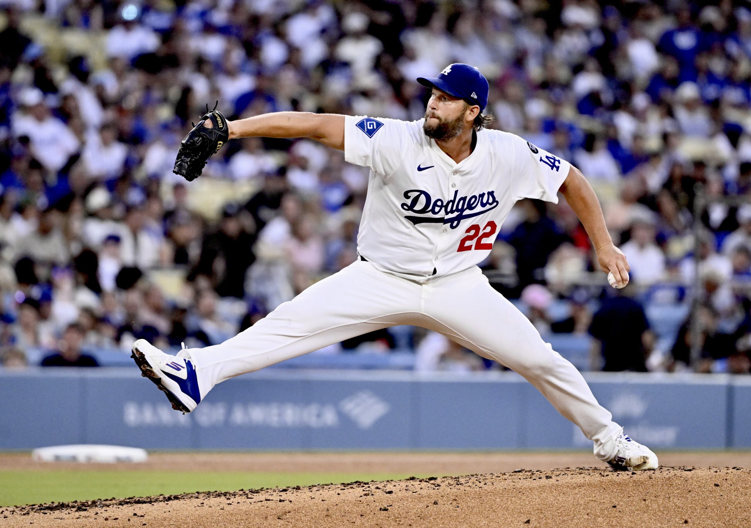 Dodgers starting pitcher Clayton Kershaw throws to the plate during...