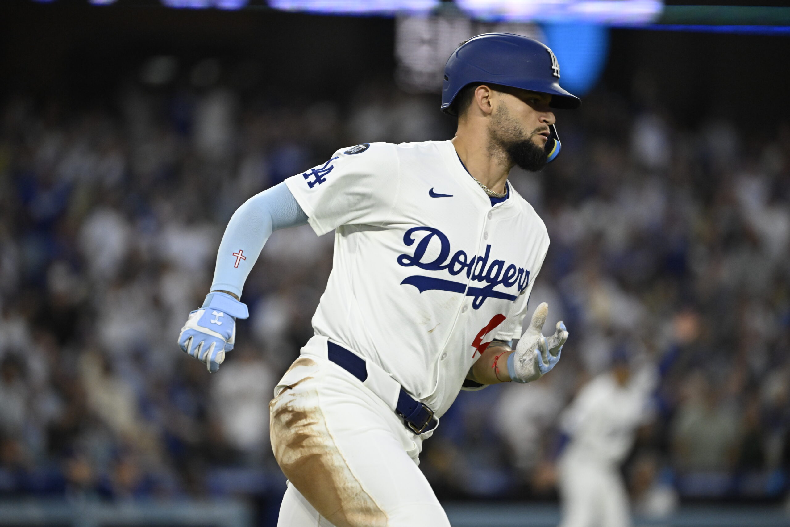 The Dodgers’ Andy Pages runs after hitting an RBI single...