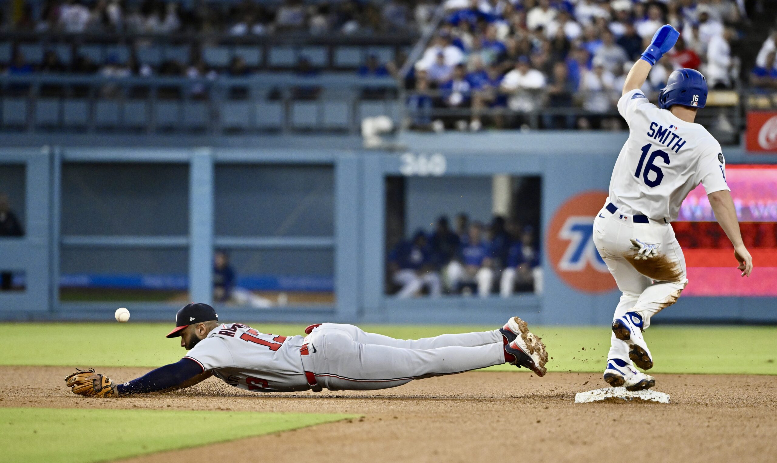 The Dodgers’ Will Smith, right, is safe at second base...