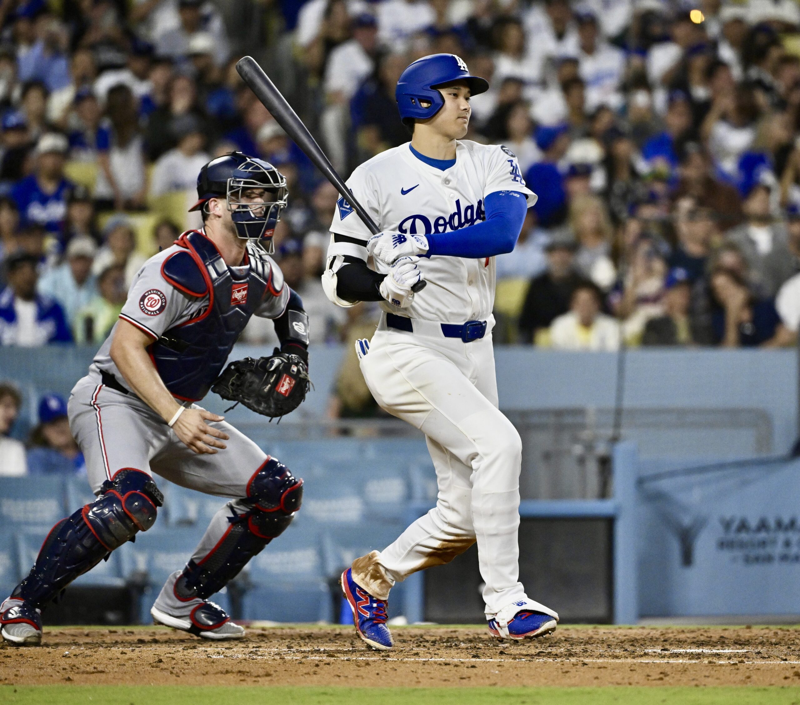 Dodgers star Shohei Ohtani hits an RBI single during the...