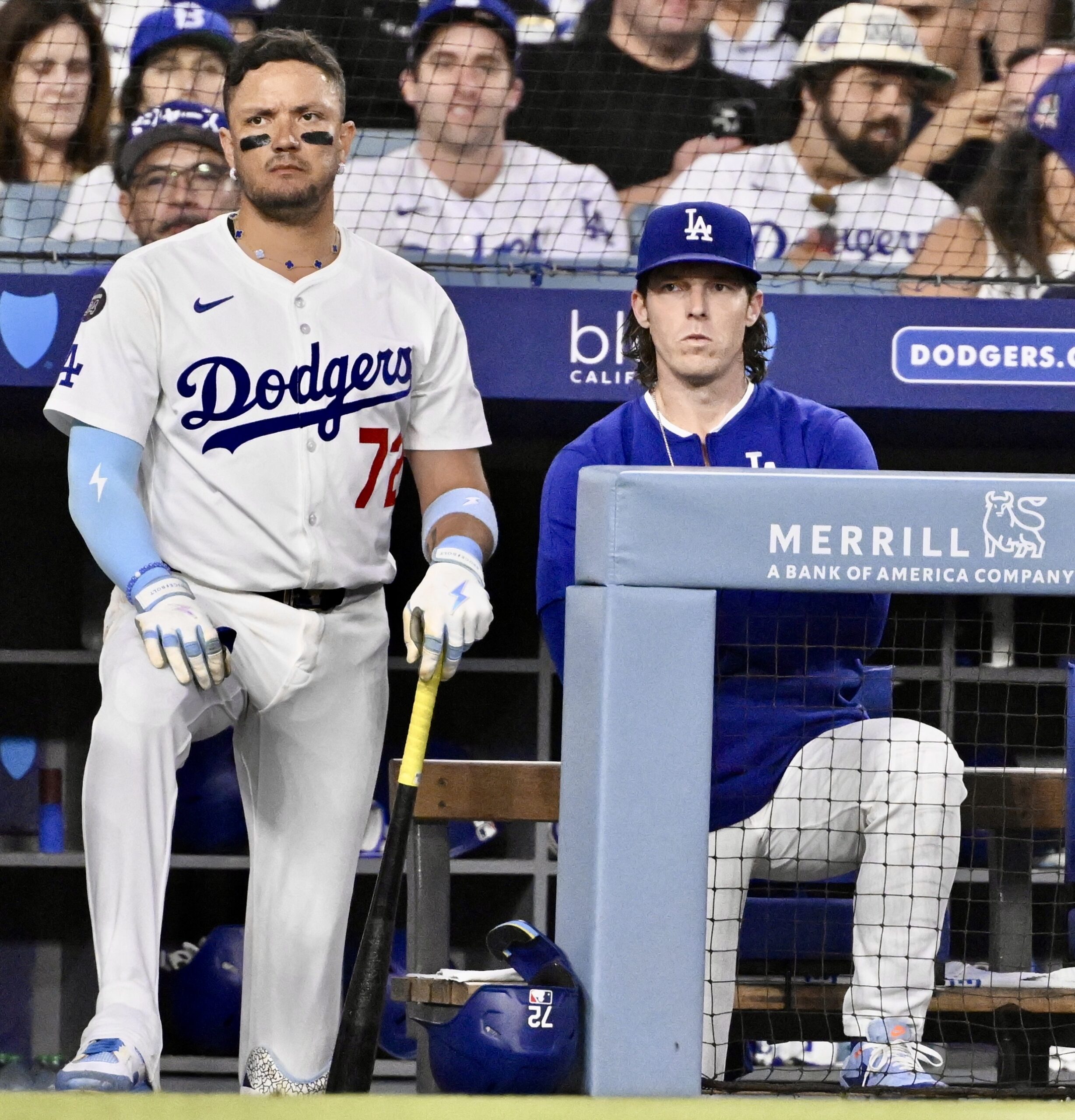 Dodgers acting manager Danny Lehman, right, and infielder Miguel Rojas...