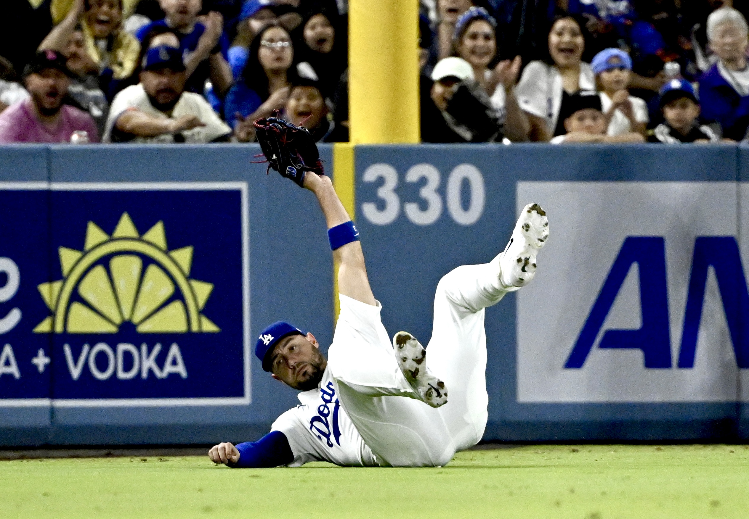 Dodgers left fielder Michael Conforto makes a diving catch on...