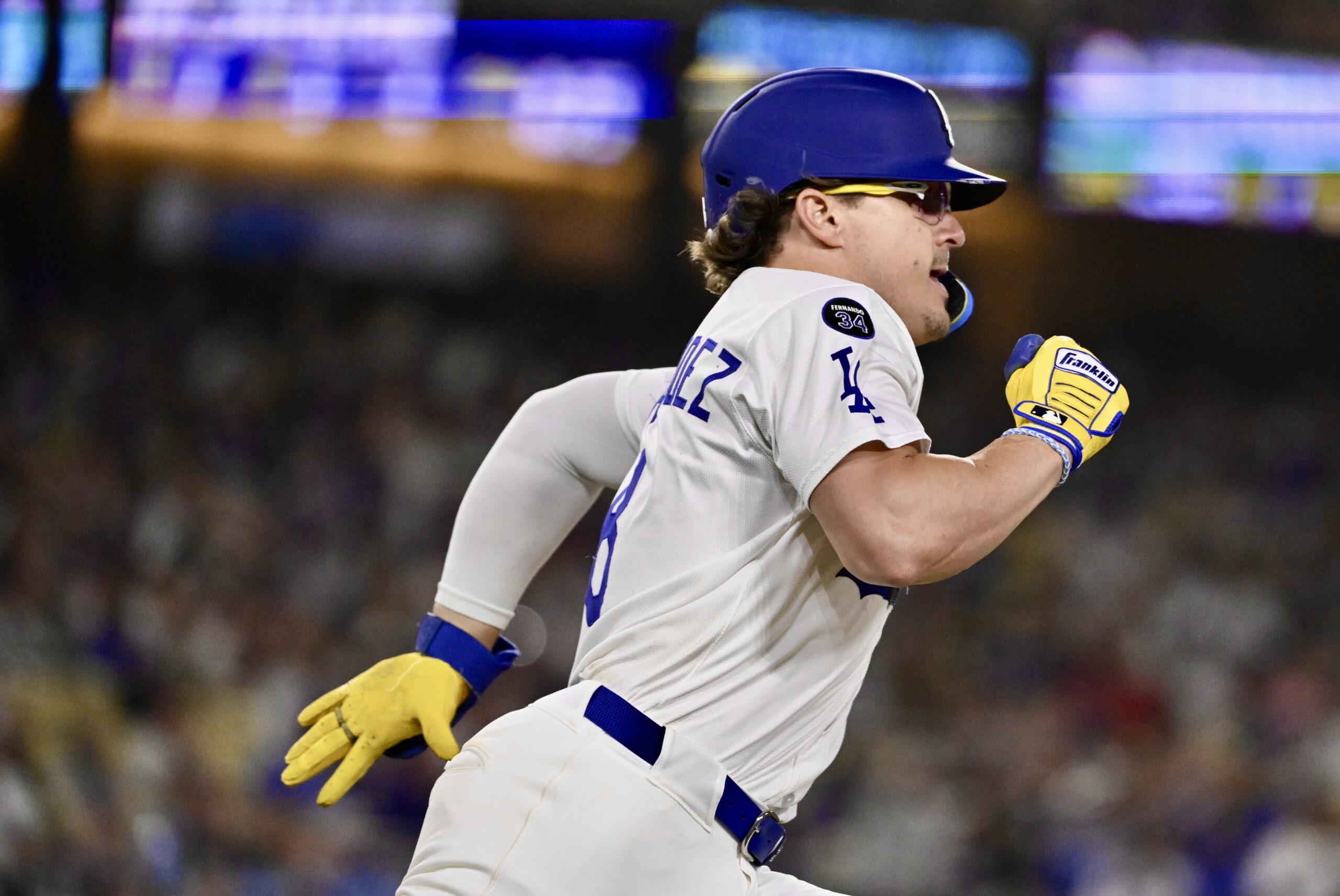 The Dodgers’ Kike Hernandez runs after hitting a double during...