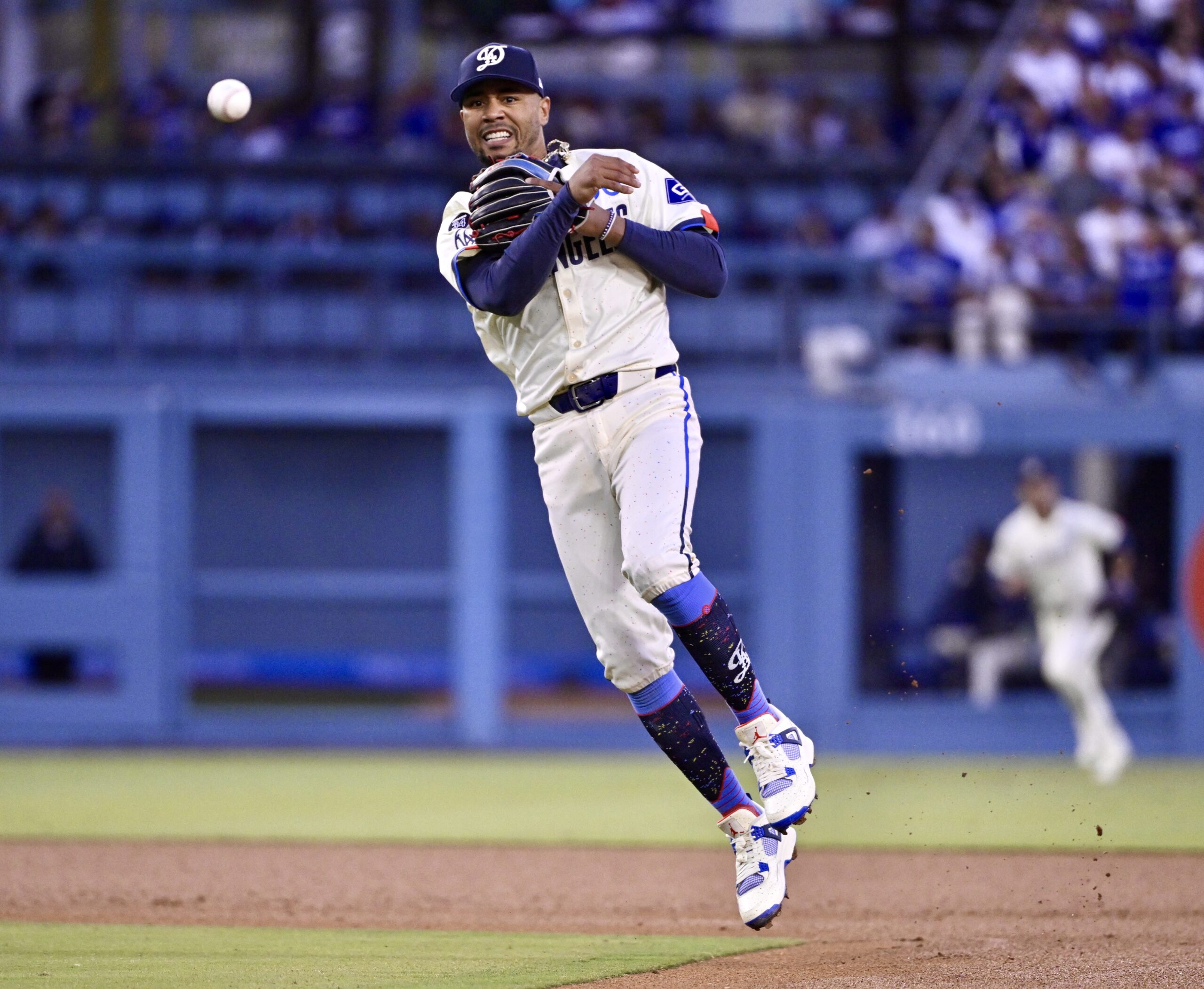 Shortstop Mookie Betts of the Dodgers throws out CJ Abrams...