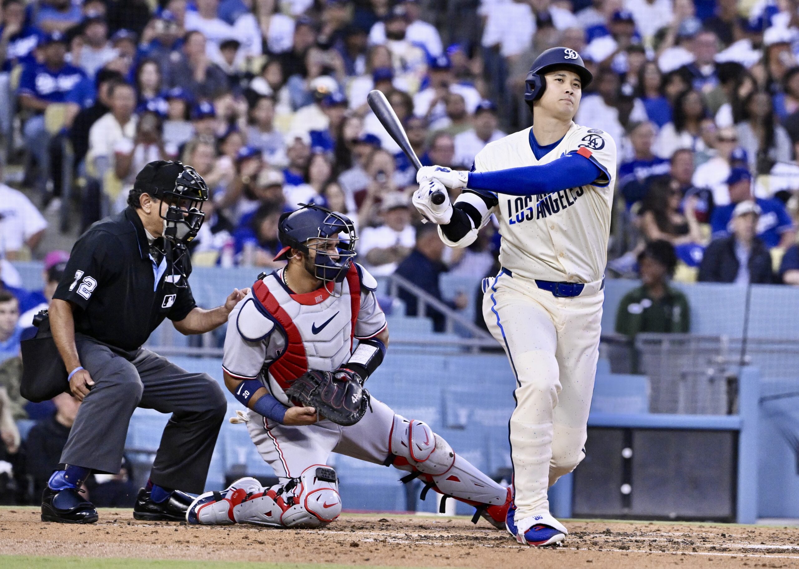 Shohei Ohtani #17 of the Dodgers strikes out swinging against...