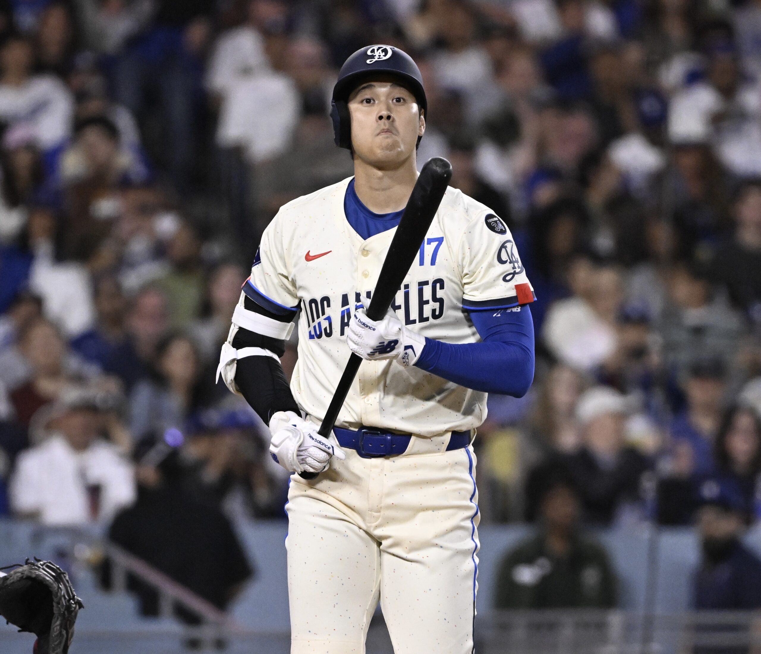Shohei Ohtani #17 of the Dodgers reacts during a at...