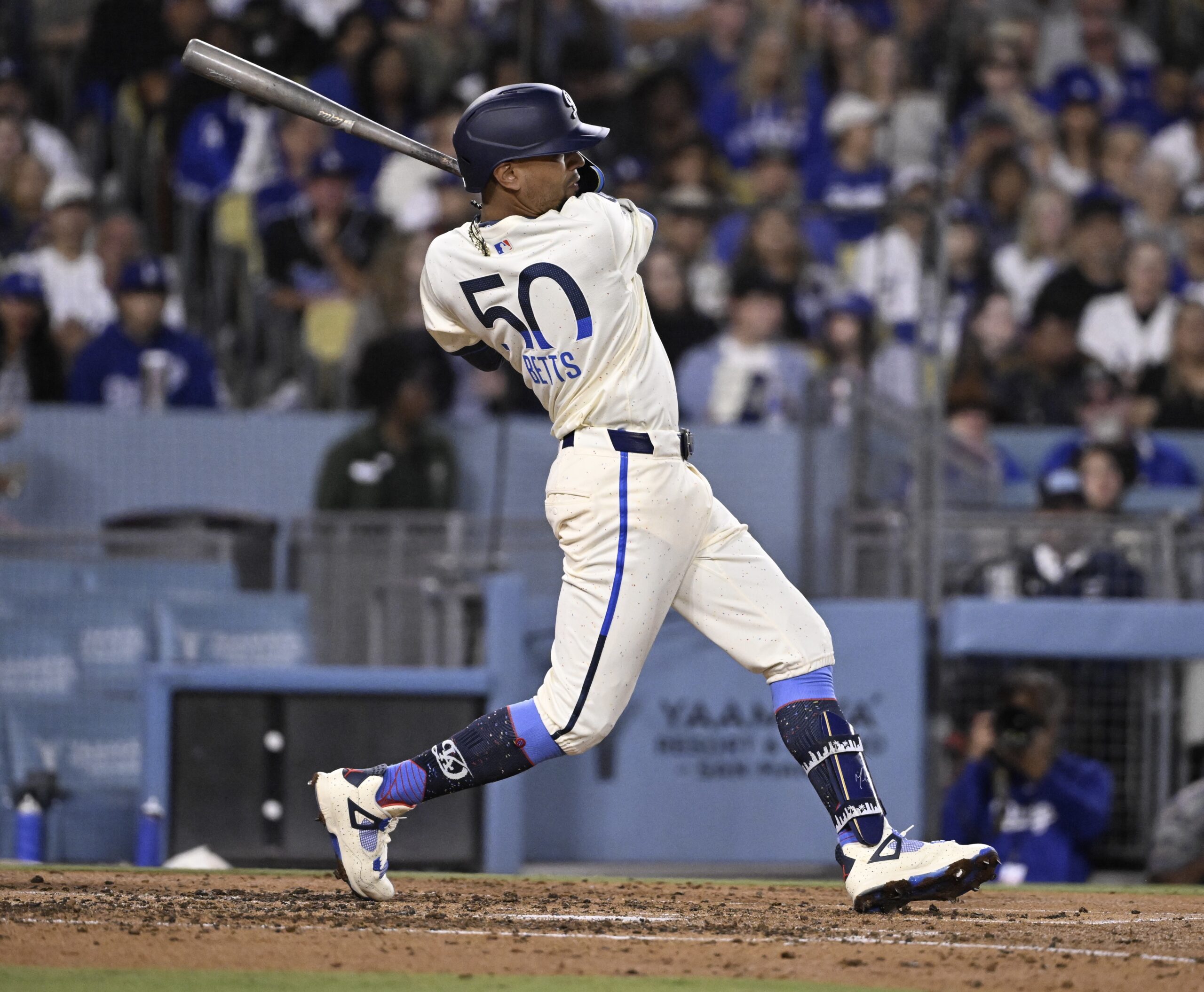 Mookie Betts #50 of the Dodgers singles against the Washington...