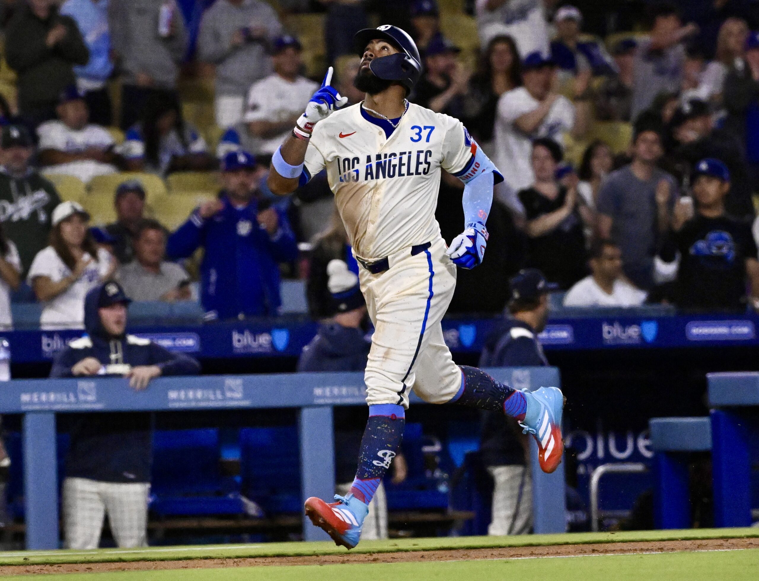 Teoscar Hernandez #37 of the Dodgers points to the sky...