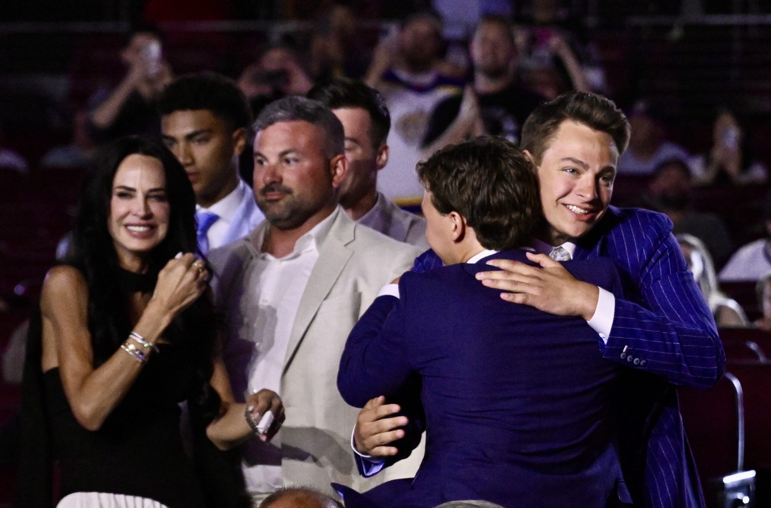 Henry Brzustewicz, right, hugs family and friends after the Kings...